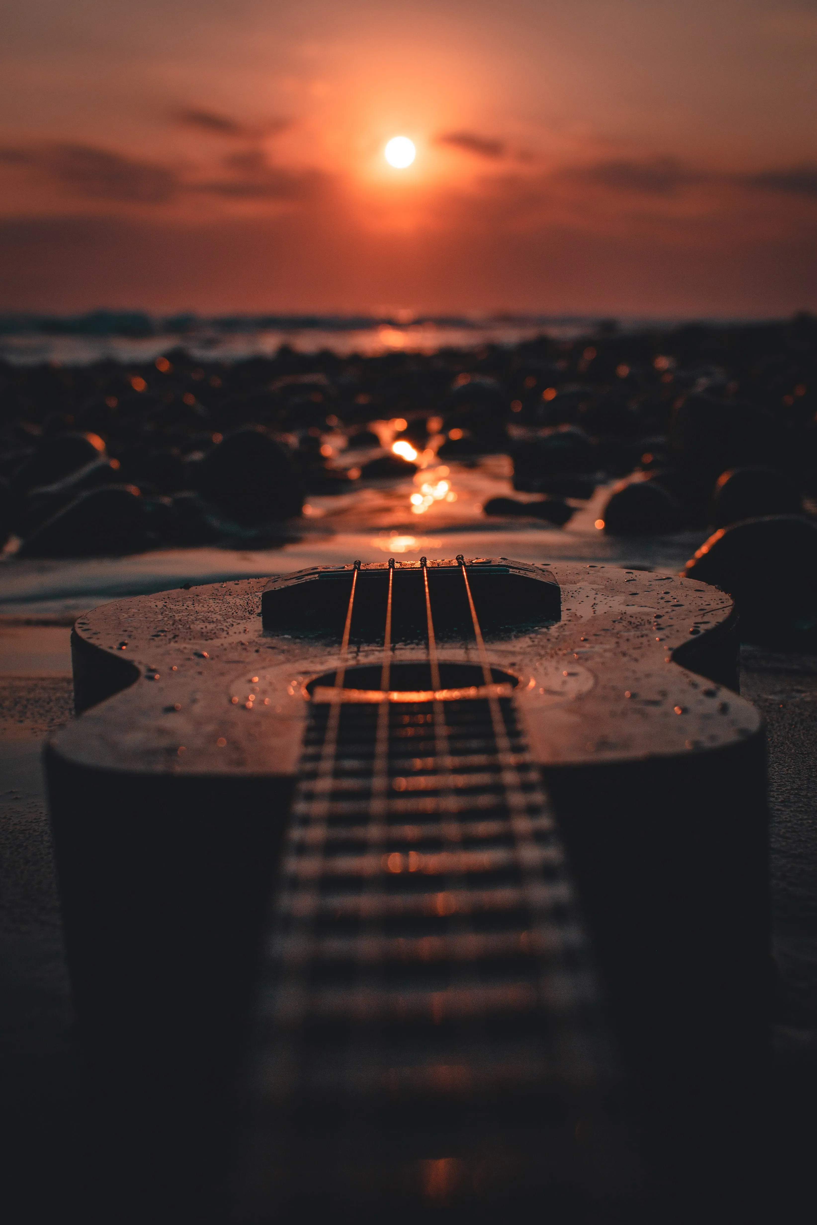 Peaceful Sunset Reflection with Guitar on the Shore