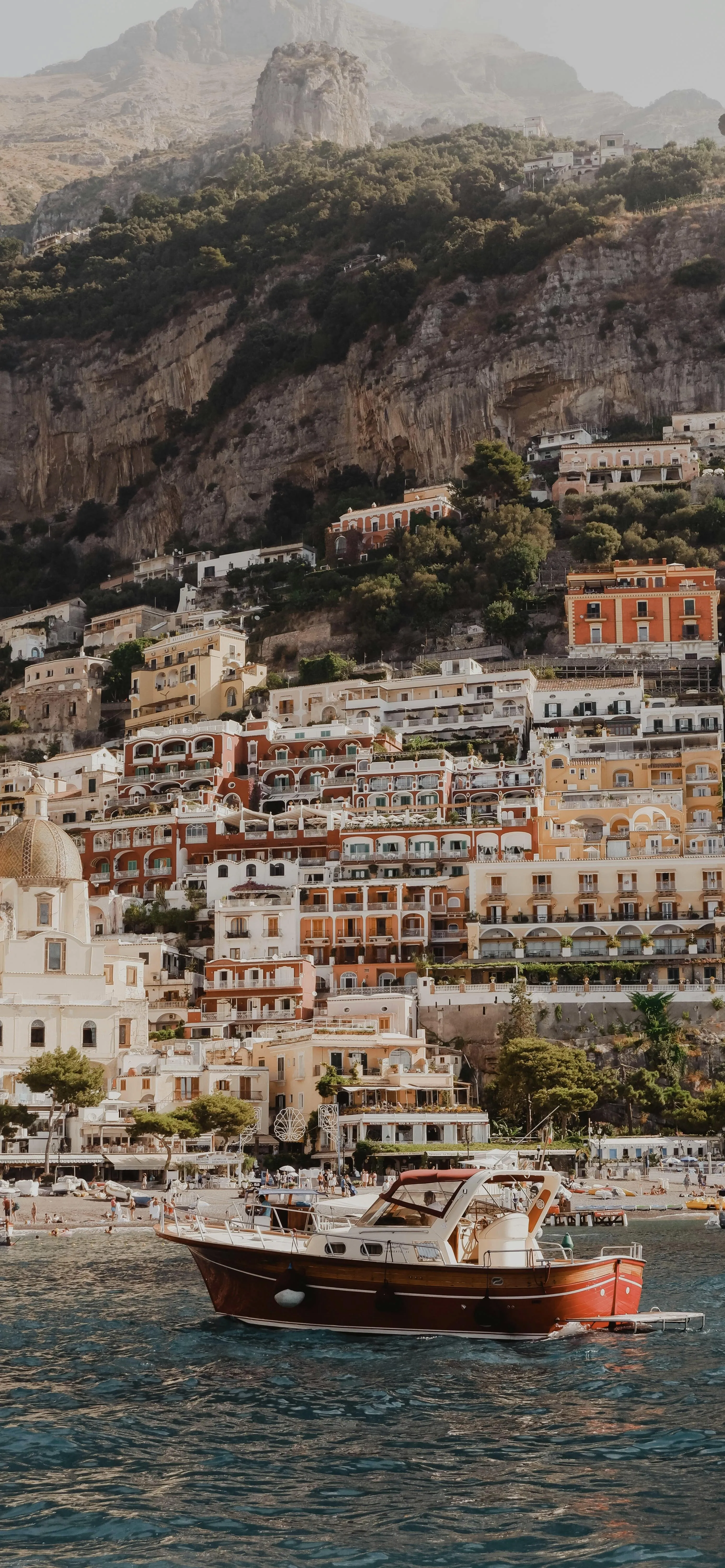 Picturesque Coastal Town with Boats and Clear Water