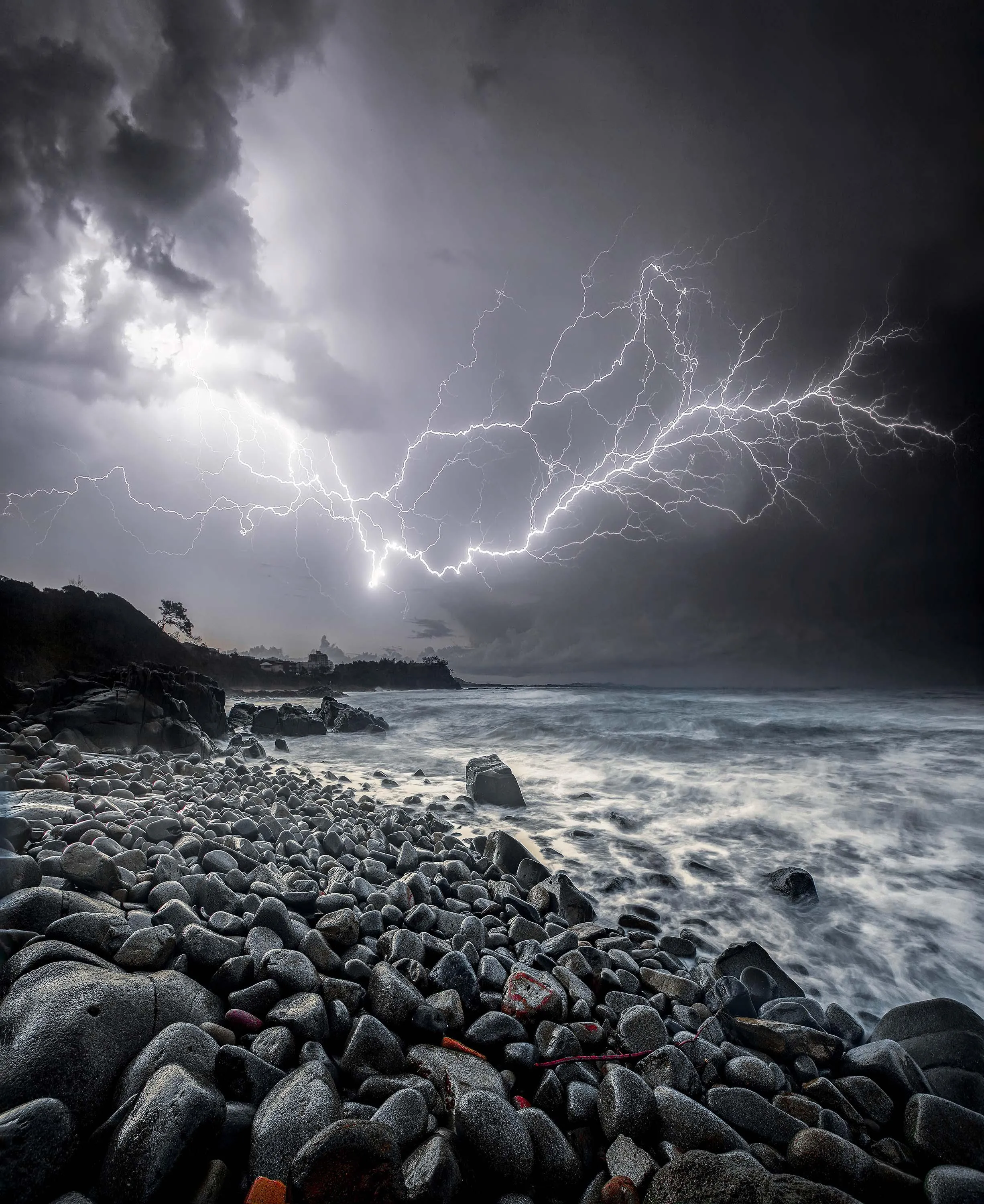 Powerful Lightning Storm Crashing Over a Rocky Shoreline