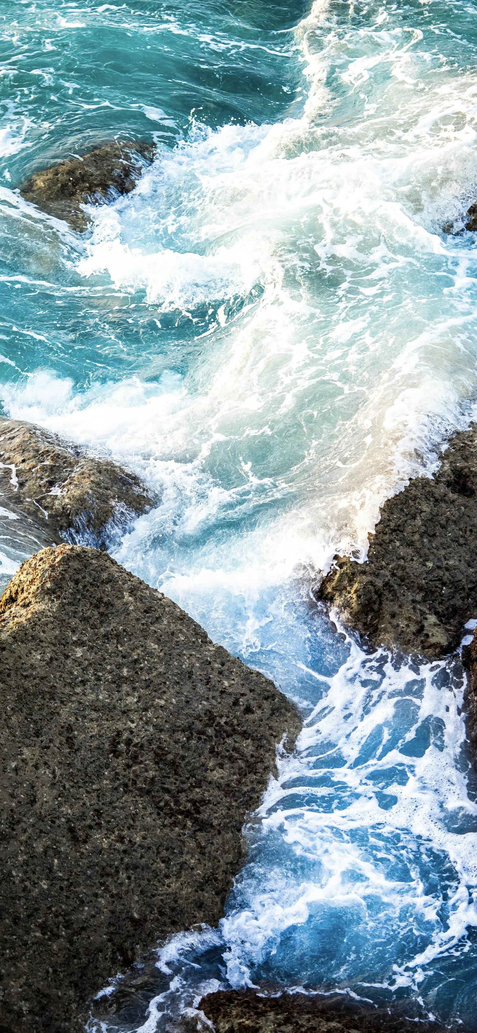 Powerful Ocean Waves Crashing Against Large Rocky Coast