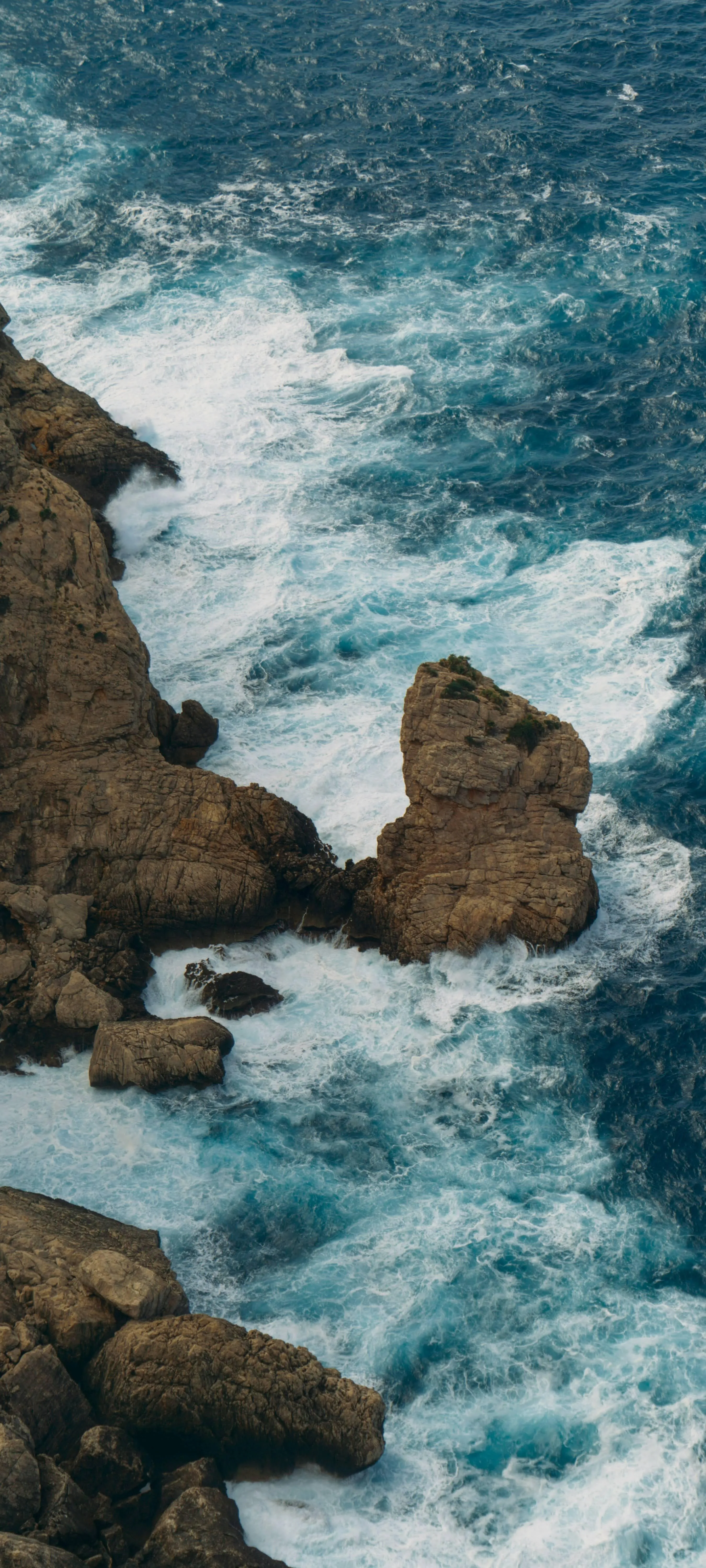 Powerful Ocean Waves Crashing on Rocky Shoreline View