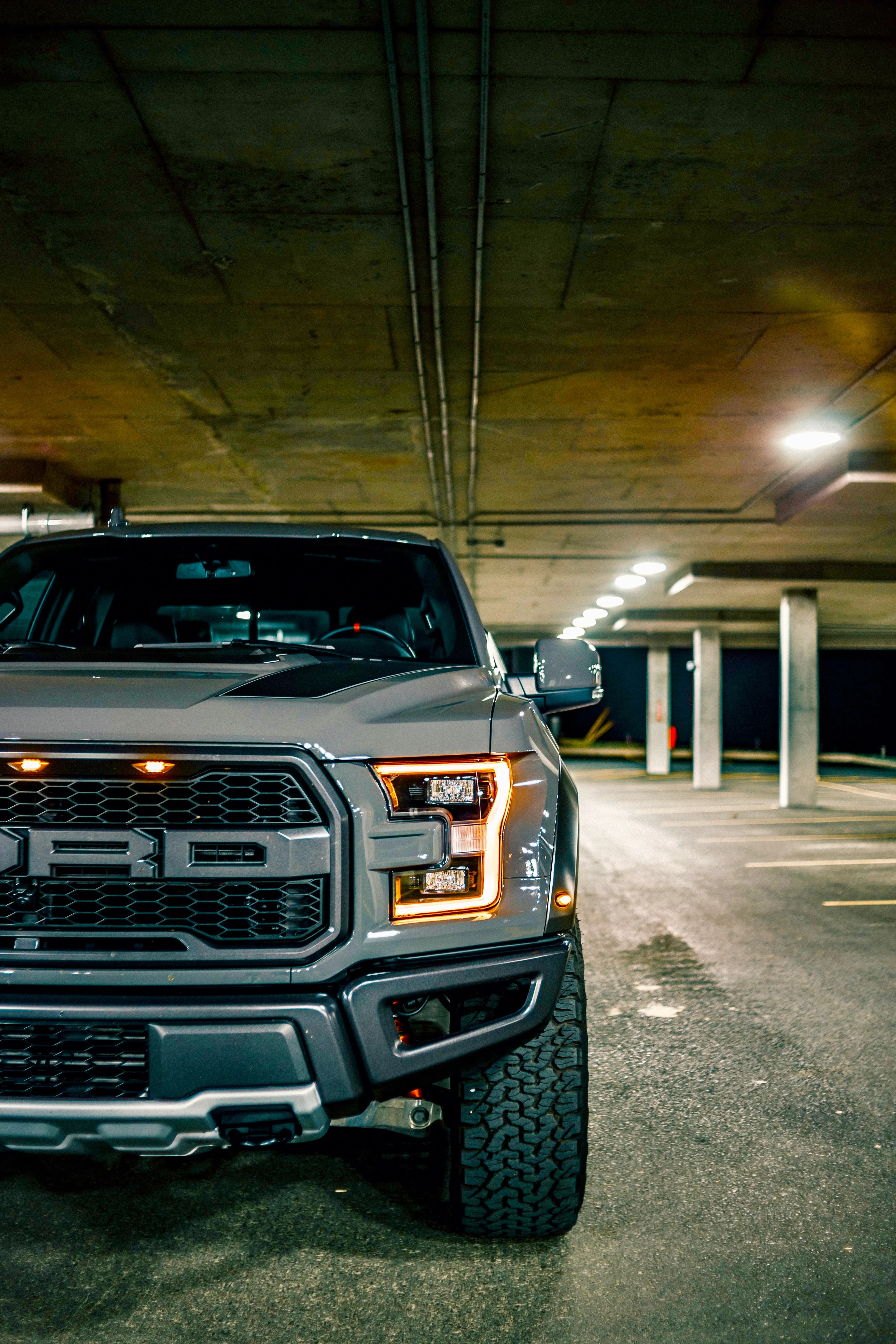 Powerful Pickup Truck Parked in Dimly Lit Garage Wallpaper