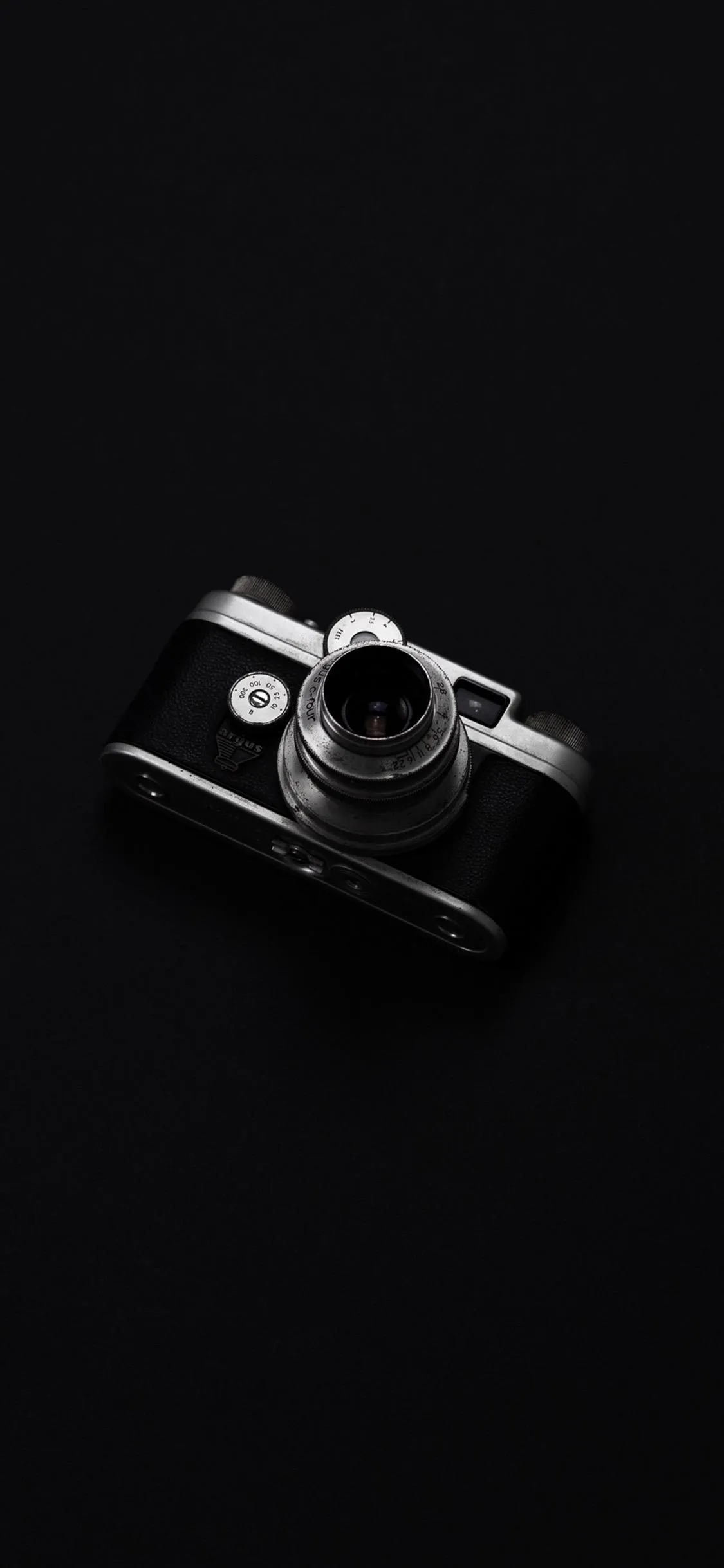 Professional Camera Lens on Elegant Black Backdrop Wallpaper