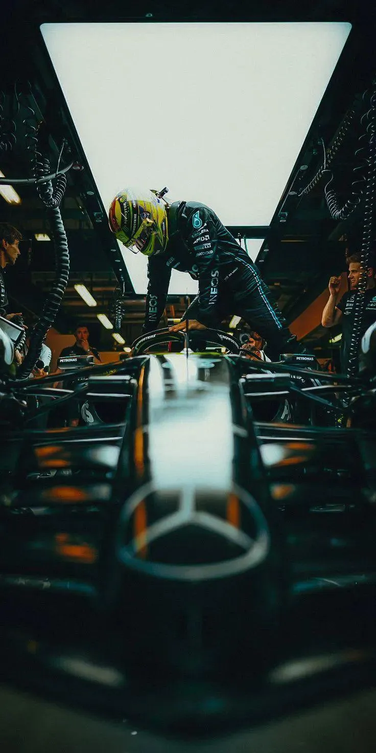 Race Driver Preparing for Action Inside the Garage