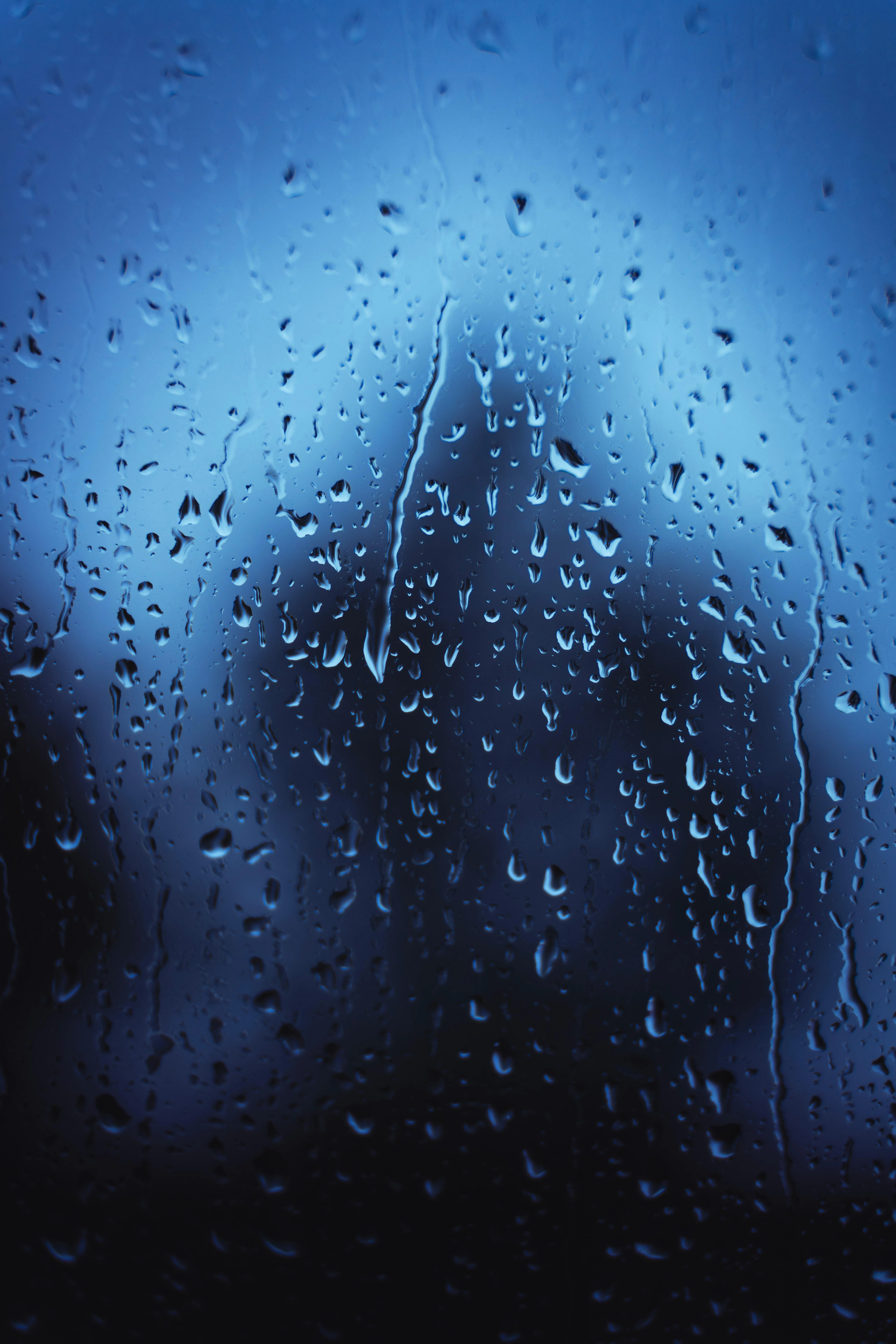 Raindrops on Window with Blurry Blue Lights Image HD