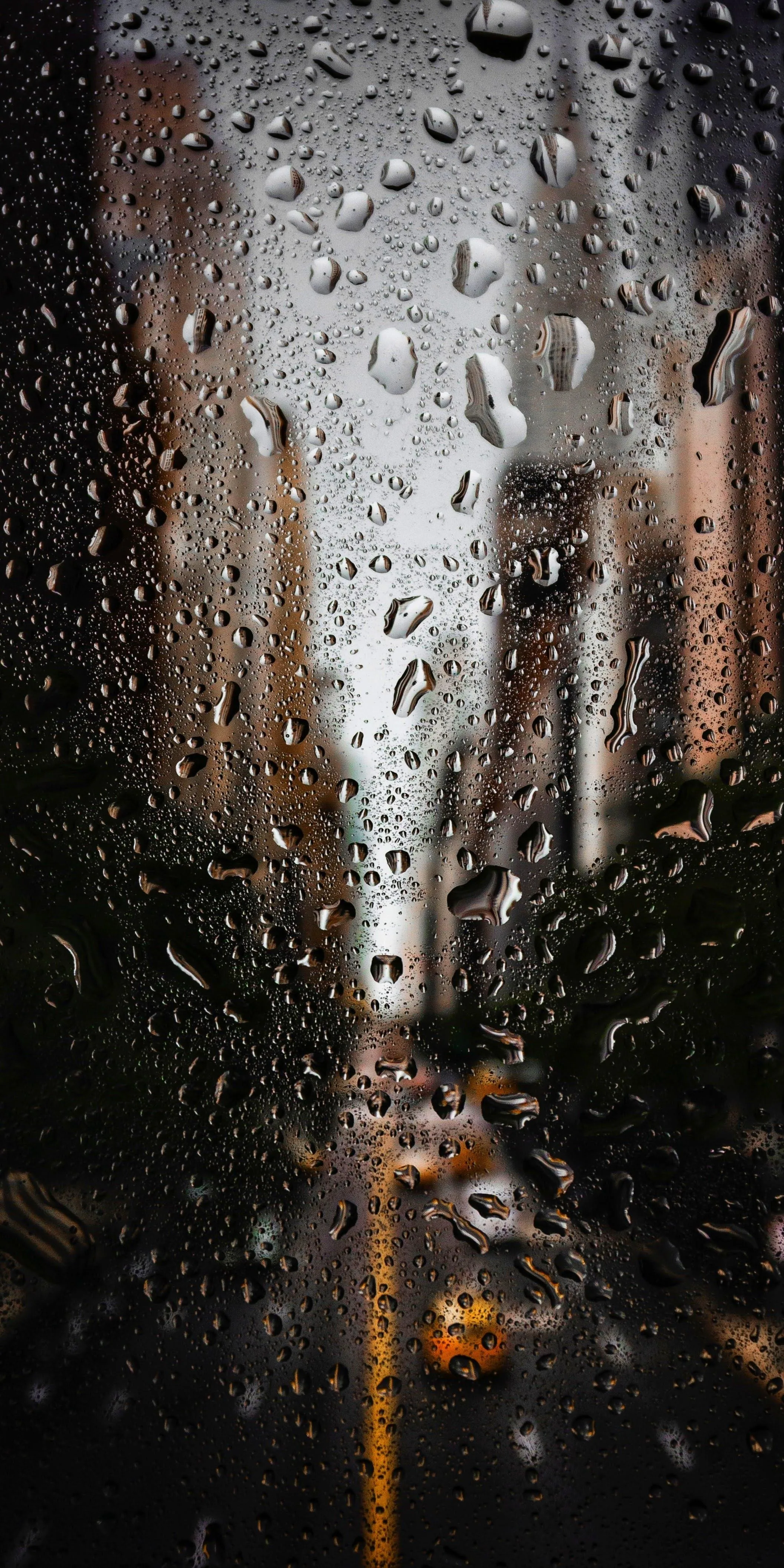 Rainy City Street View with Droplets on The Glass Wallpaper