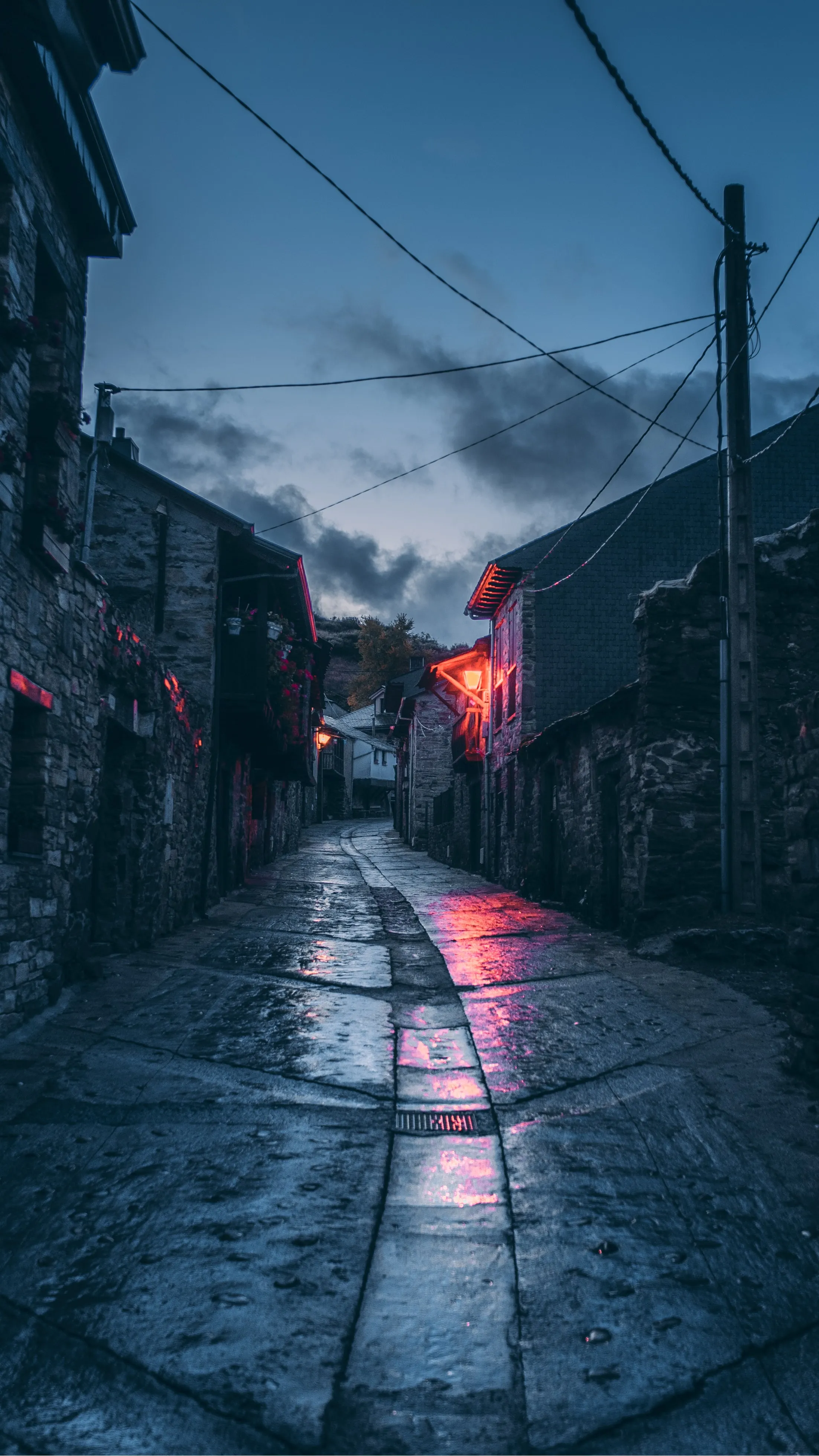 Rainy Street Alley with Blue and Red Reflections Wallpaper