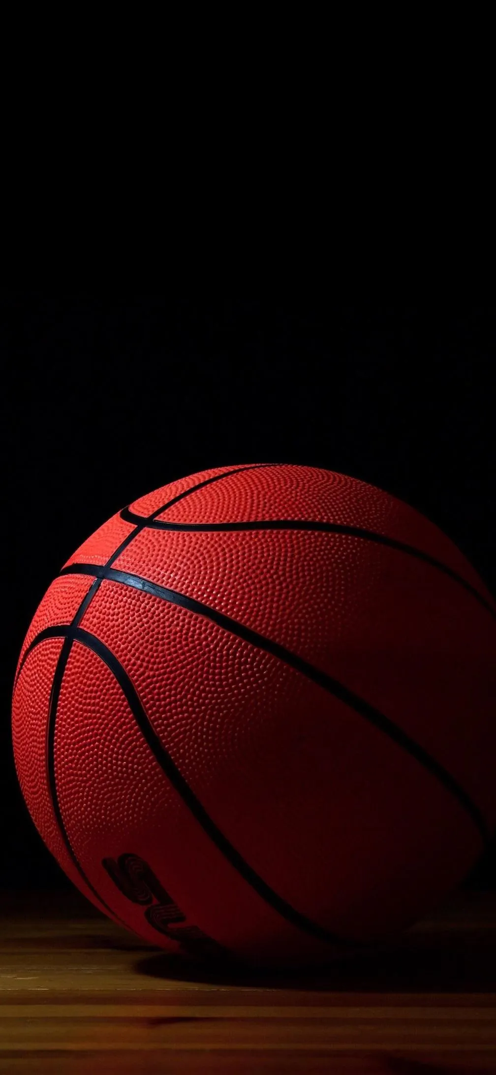 Realistic Basketball in Shadow for Sports Lovers Wallpaper