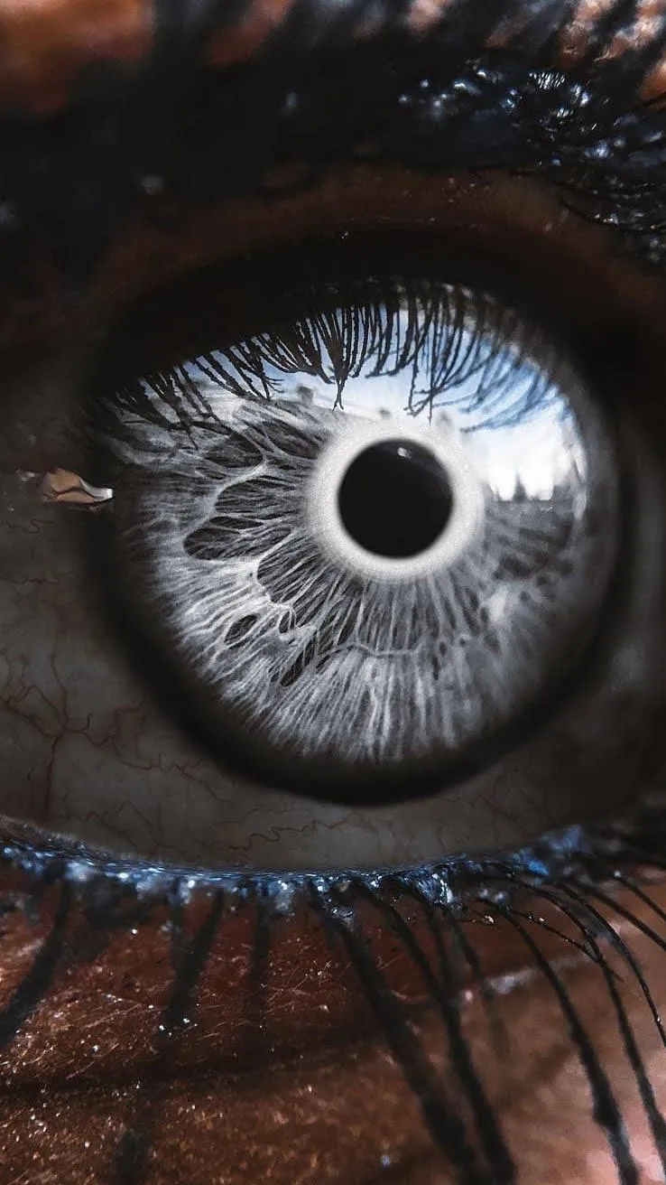 Realistic Eye Macro with Galaxy Reflection Inside Wallpaper