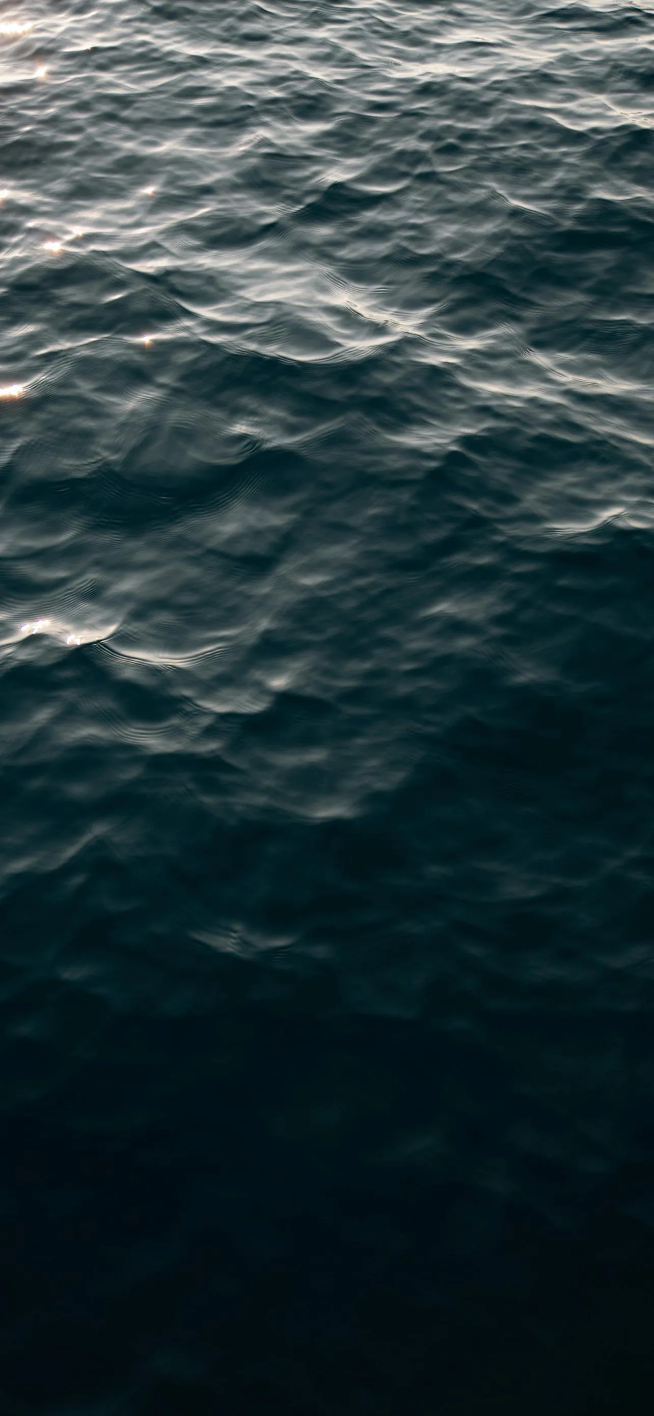 Realistic Ocean Surface with Gentle Blue Waves Wallpaper