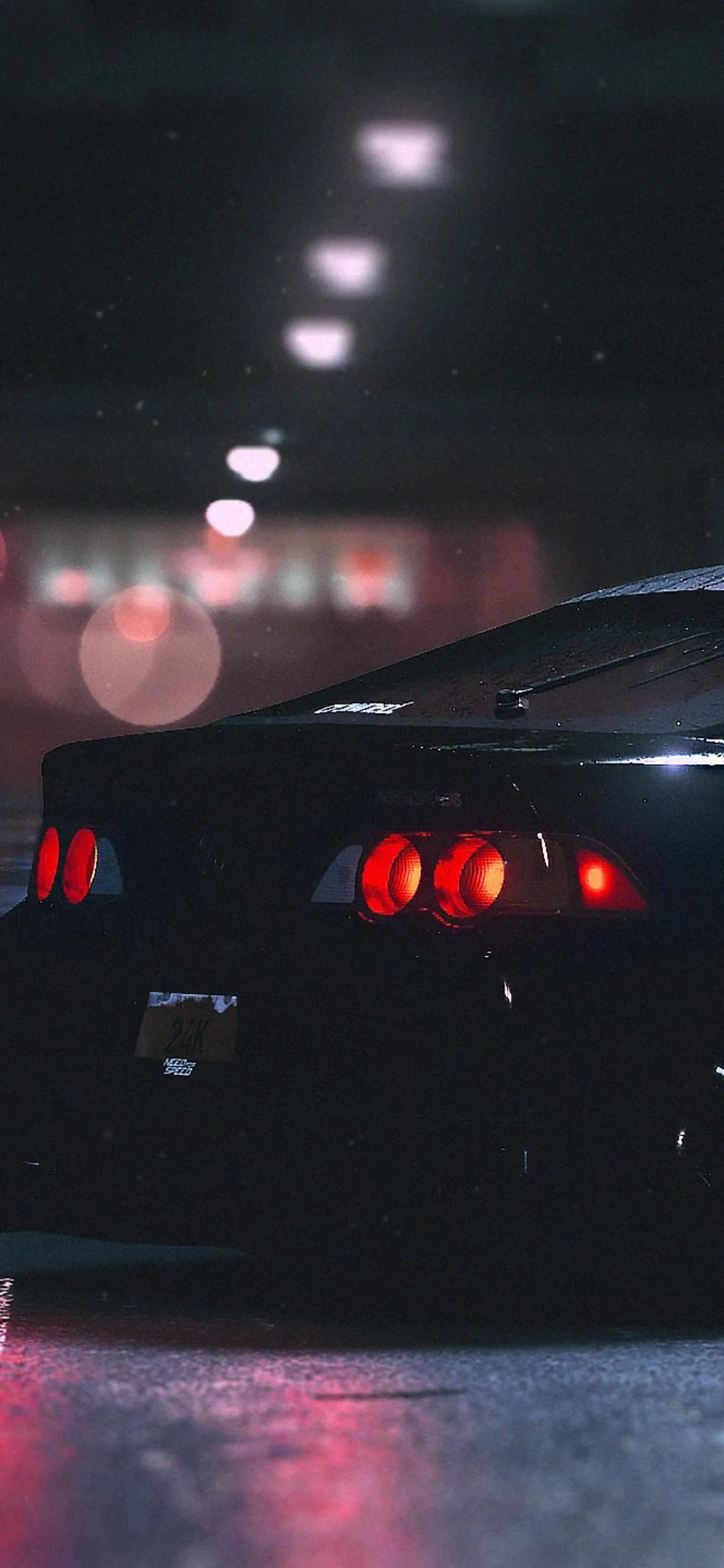 Rear View of a Black Sports Car in a Dimly Lit Tunnel