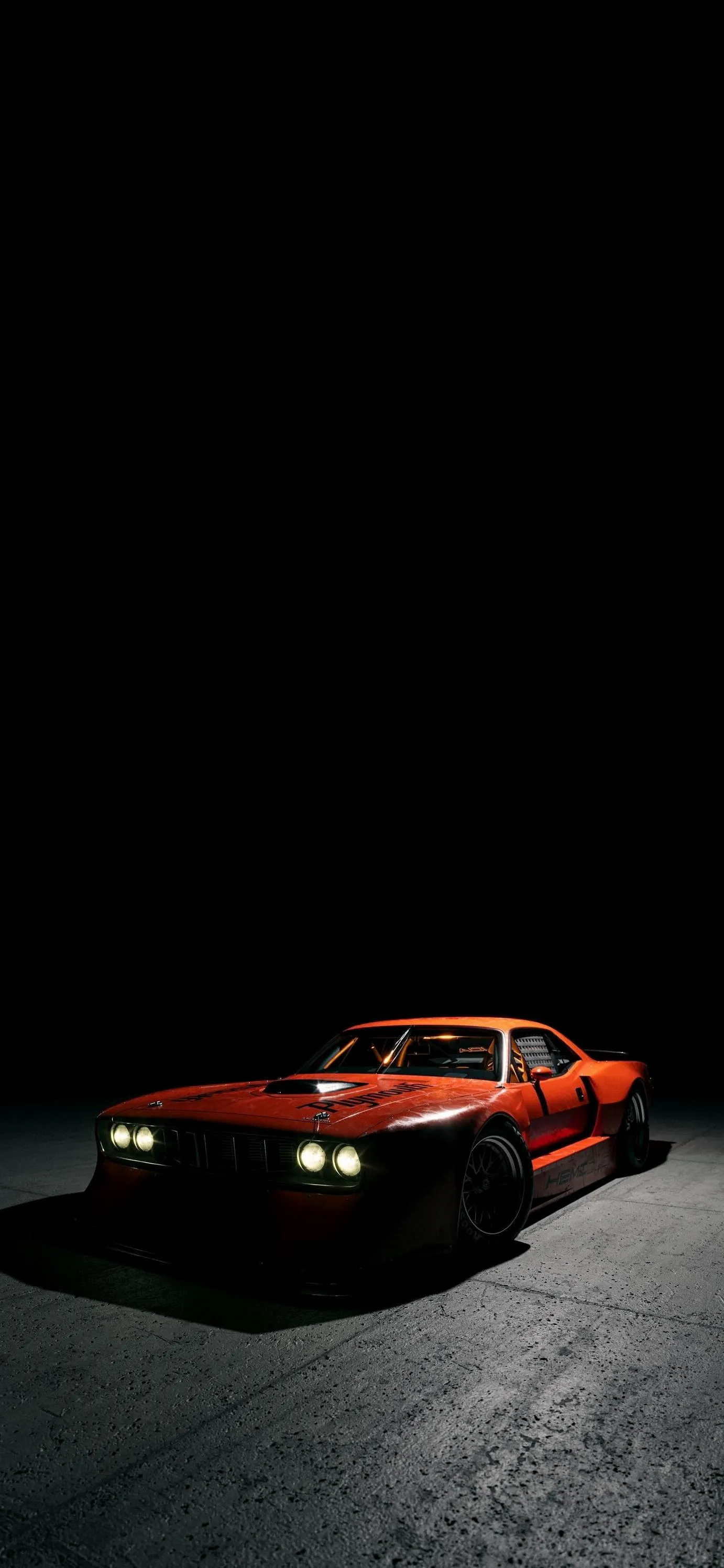 Red Car Driving Alone on Road in Pitch Black Night