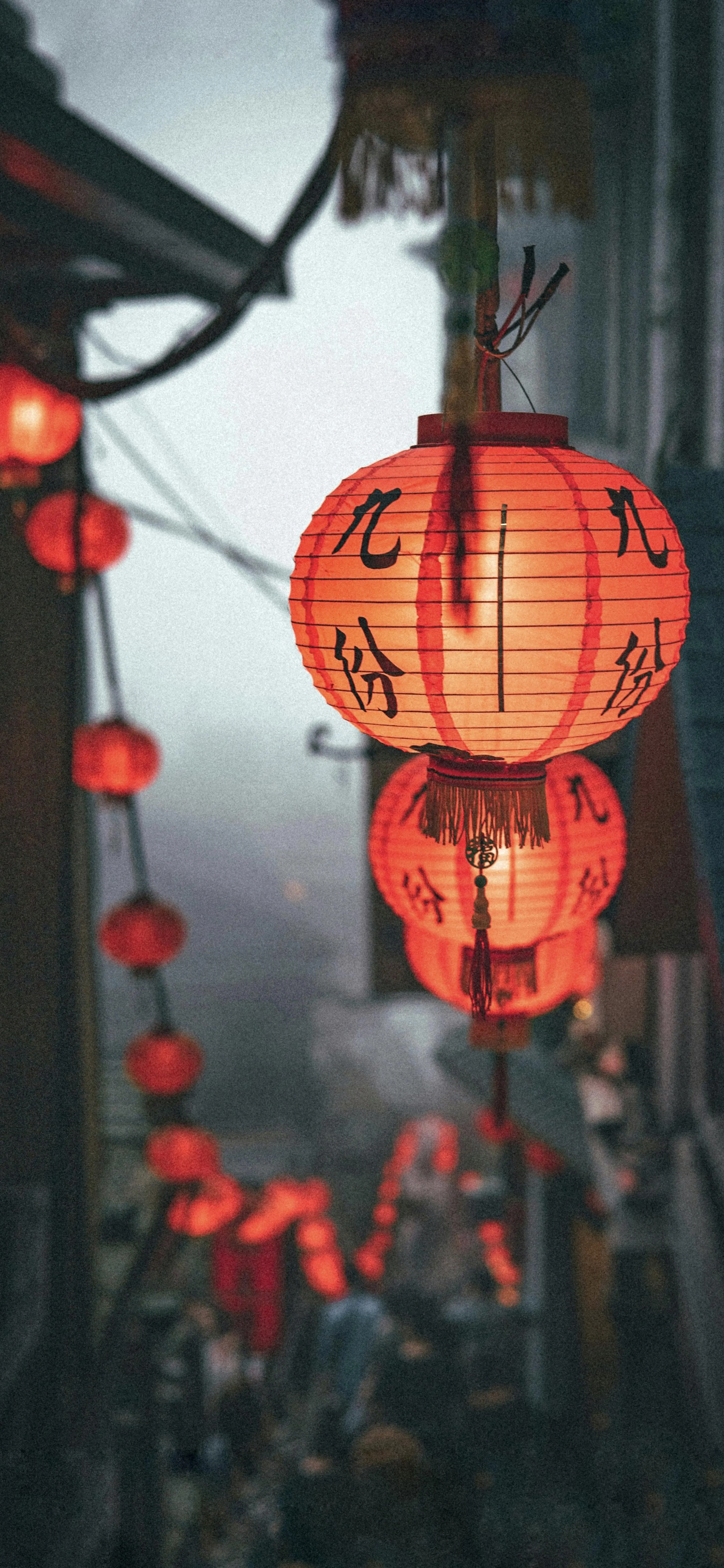 Red Chinese Lanterns Hanging in Festive Street Scene