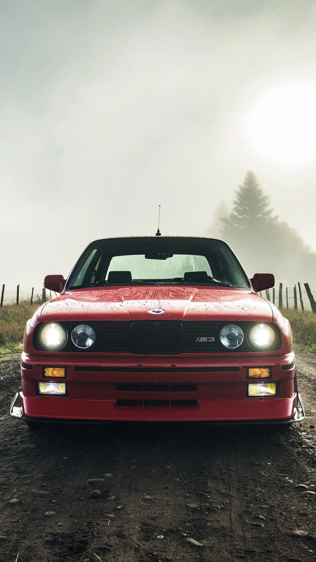 Red Classic Car Covered with Mud in Outdoor Terrain