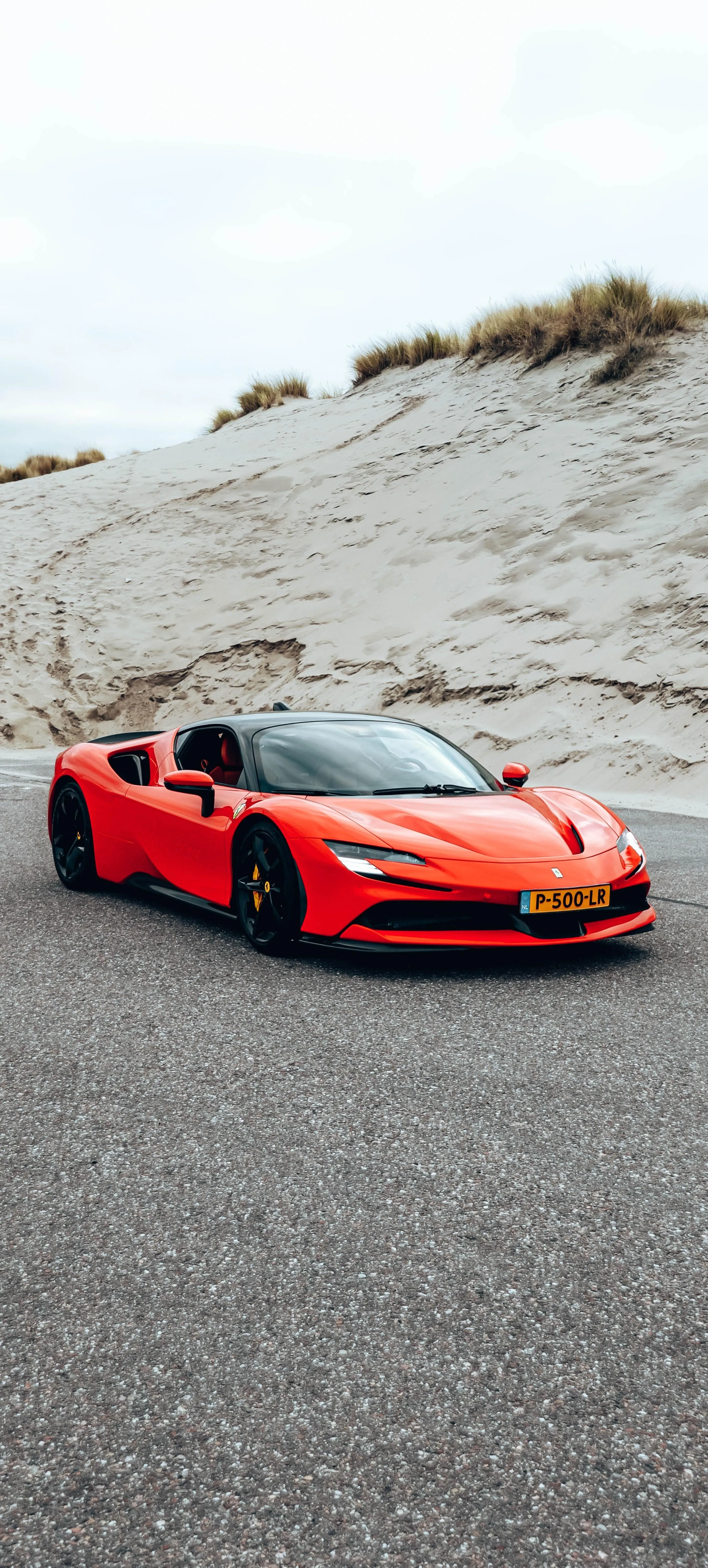Red Sports Car on Asphalt for Automotive Mobile Enthusiasts