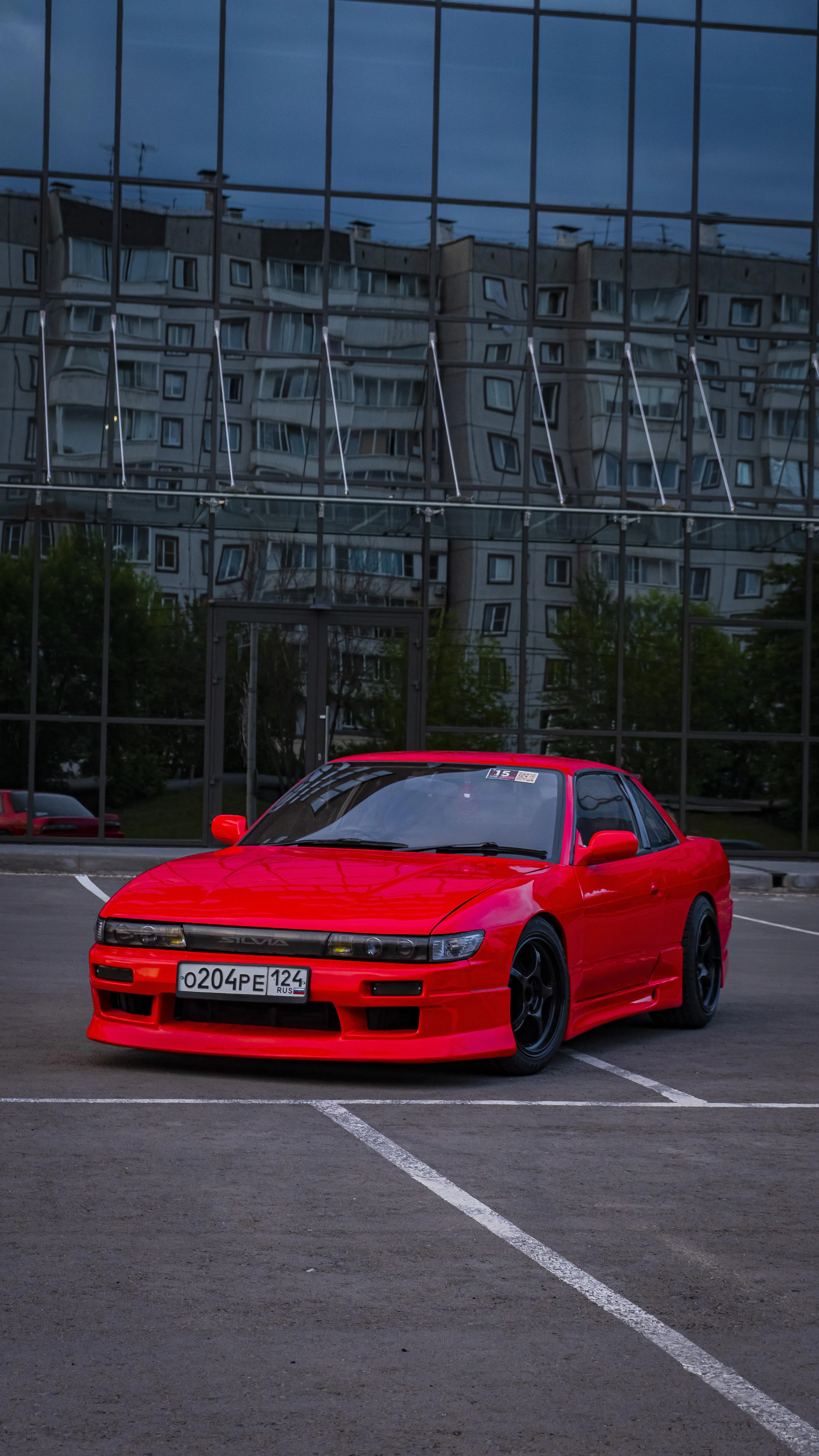 Red Sports Car Parked in Urban Outdoor Setting Image