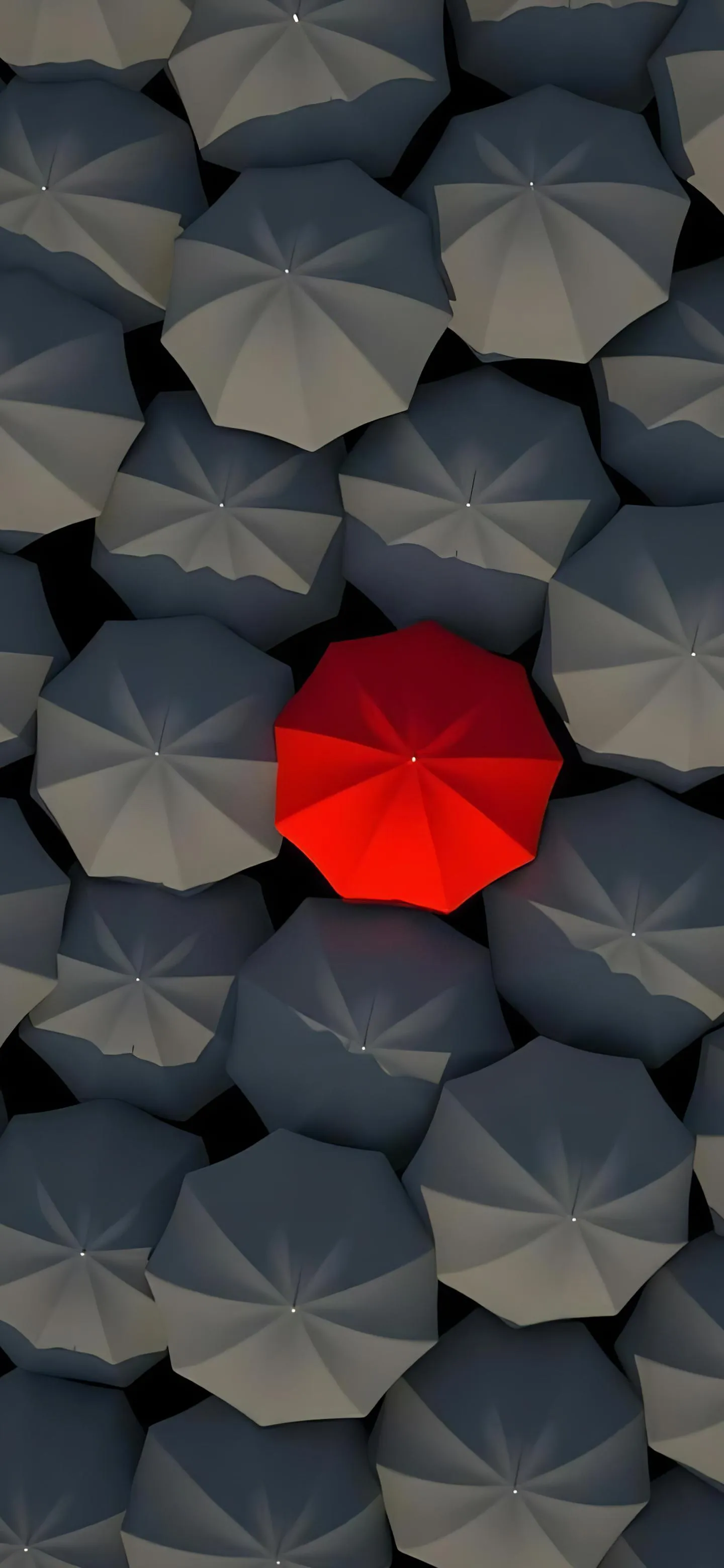 Red Umbrella Standing Out Among Gray Umbrella Crowd