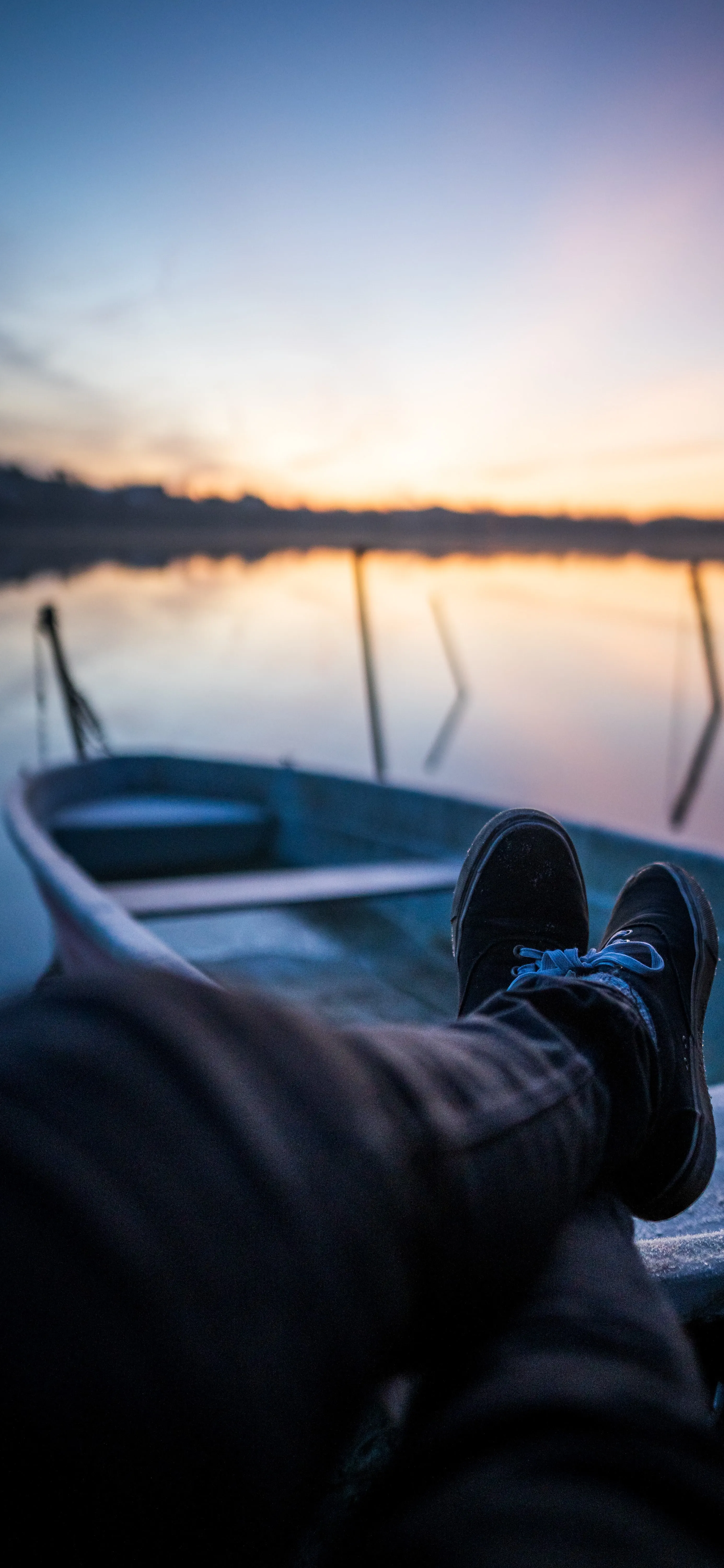 Relaxing Sunset Scene by Lake with Feet Up View Image