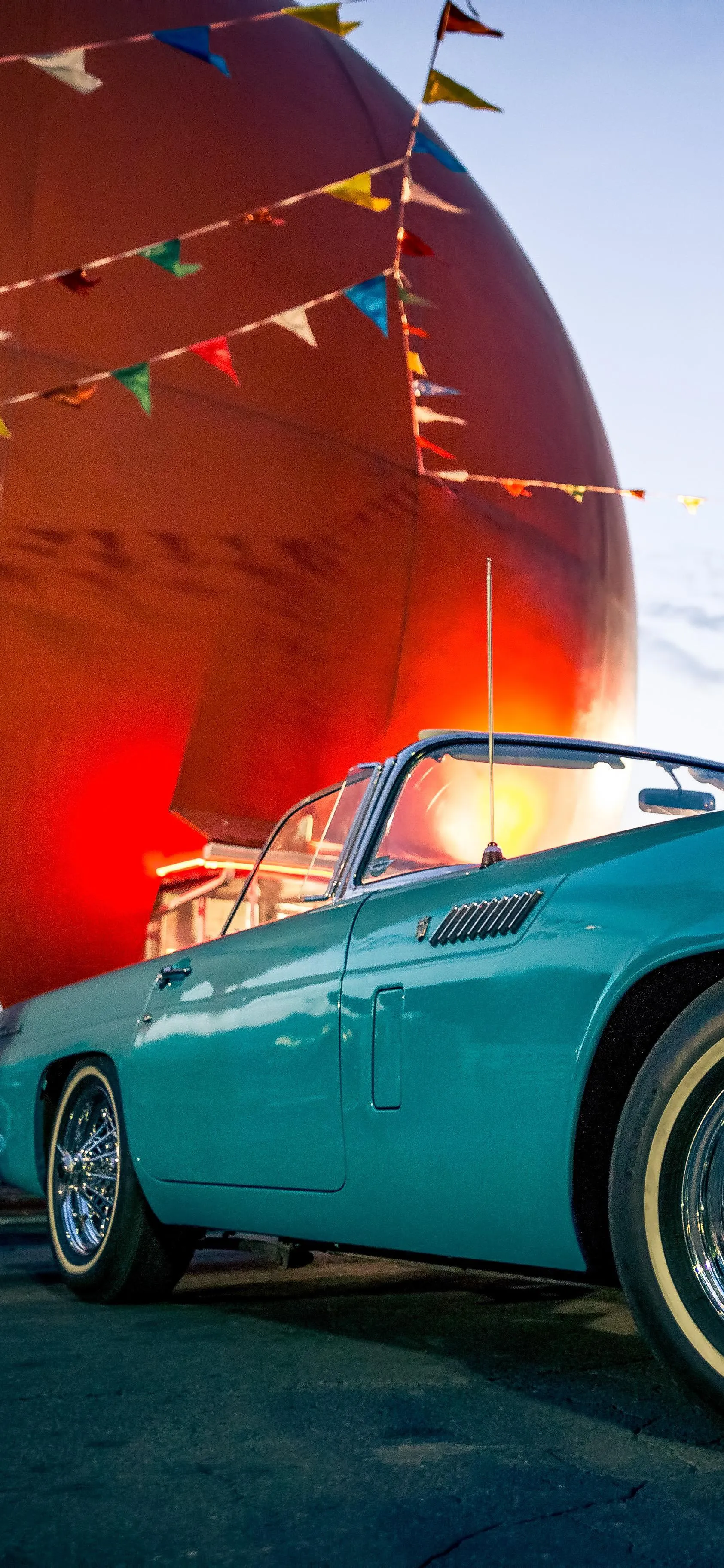 Retro Green Sports Car in Futuristic Garage Art Wallpaper