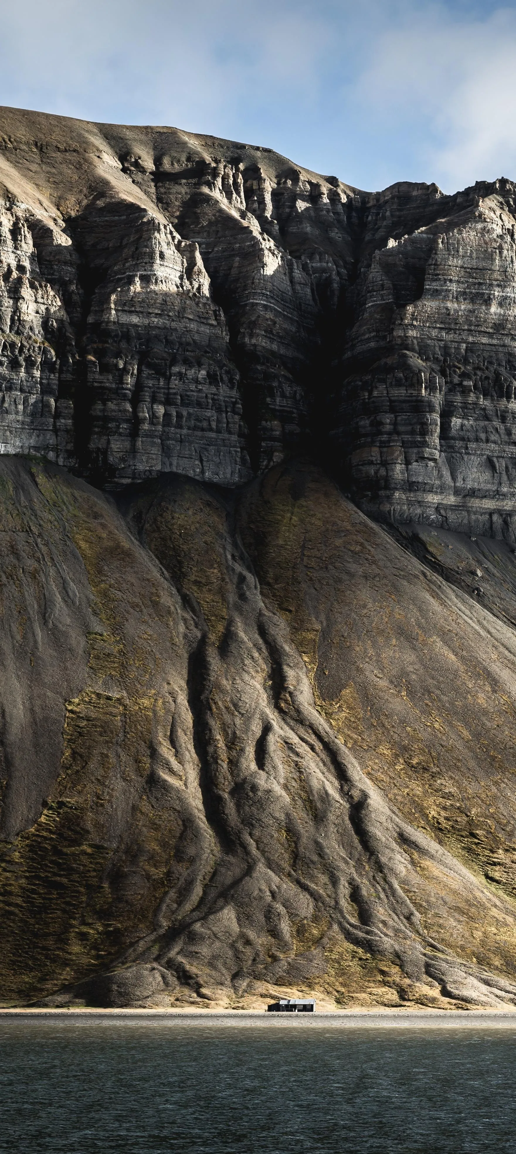 Rocky Mountain Landscape Under Cloudy Blue Sky Wallpaper