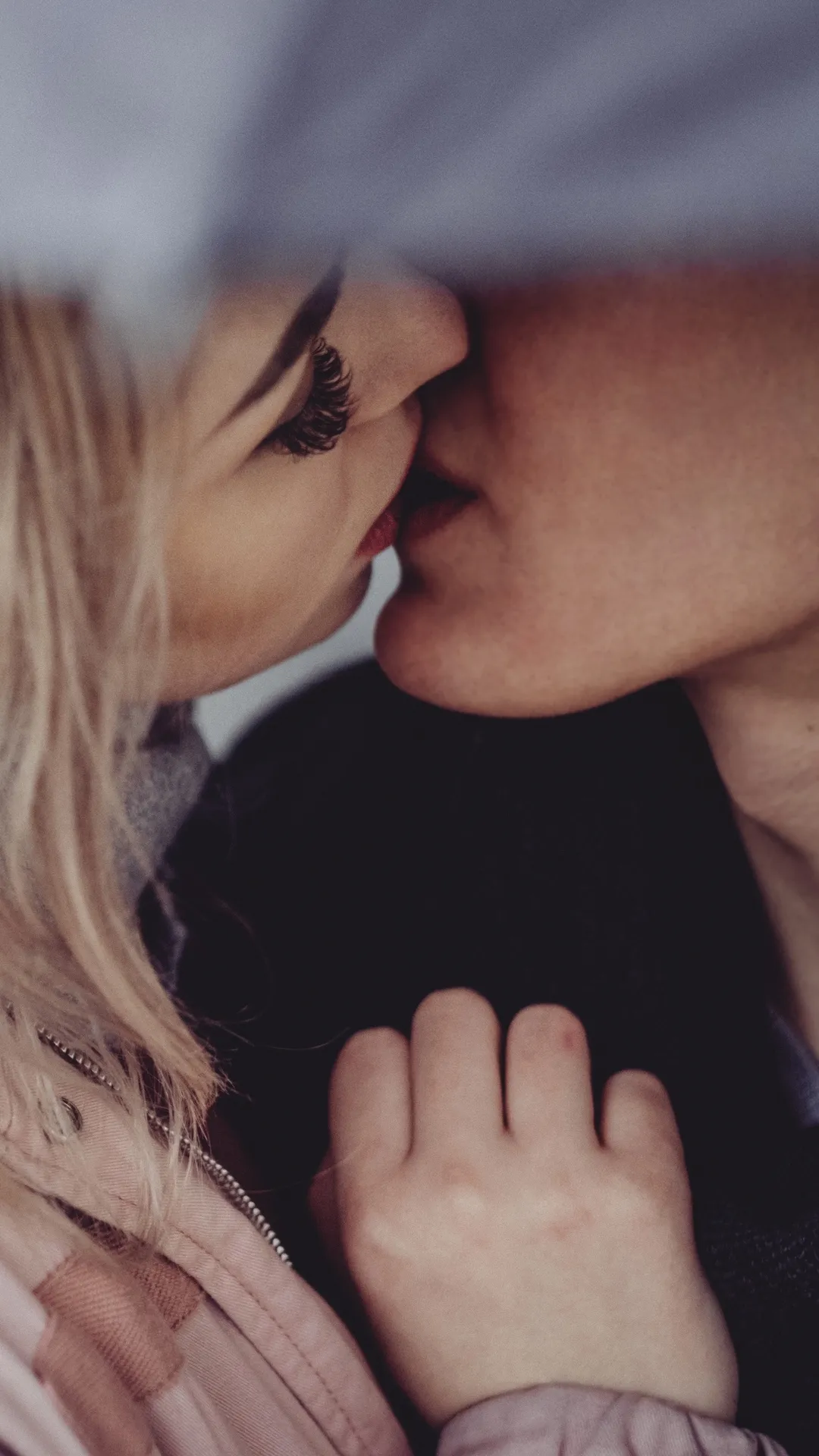 Romantic Couple Sharing Tender Moment in Light Wallpaper