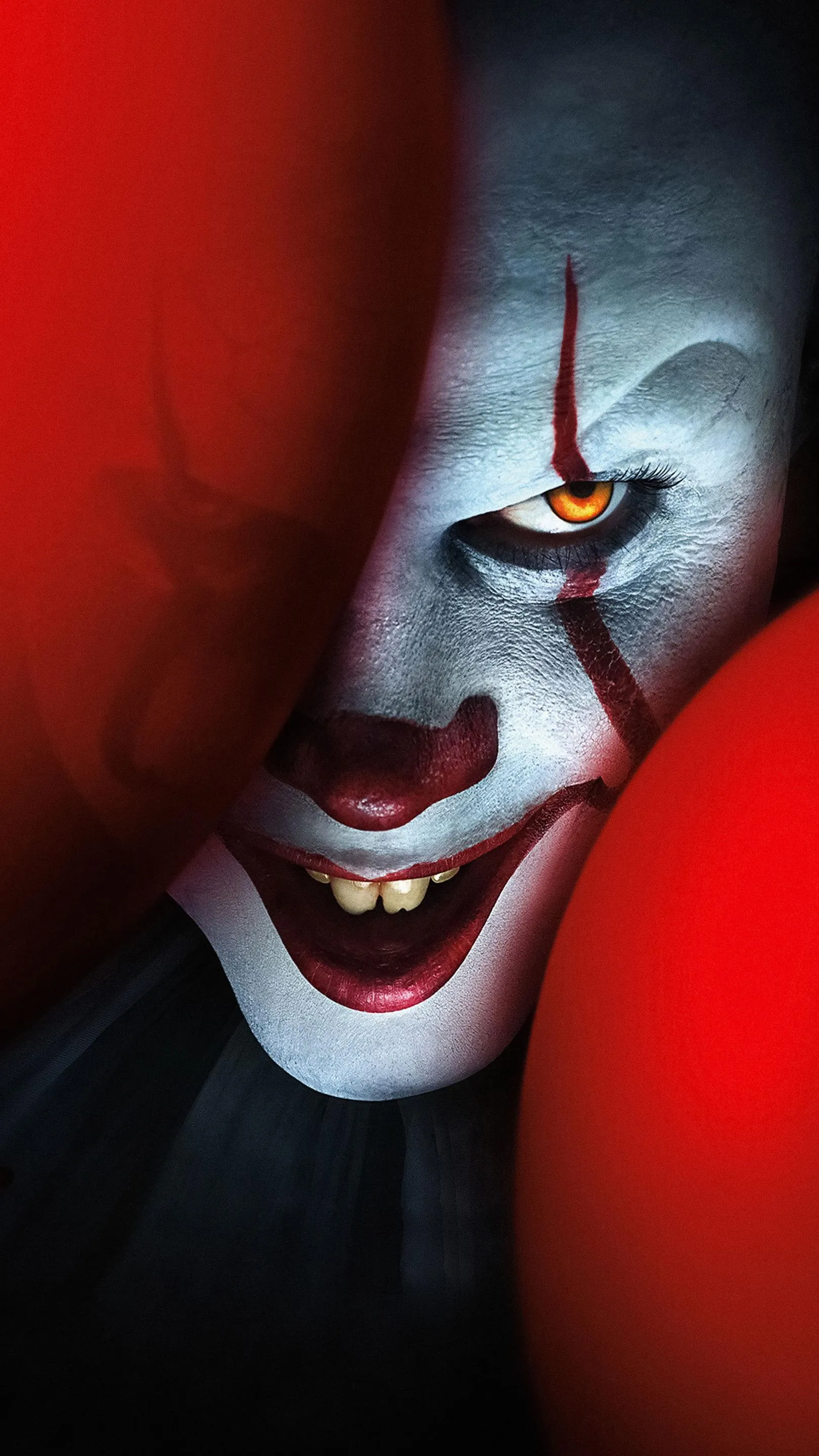 Scary Clown Face with Red Balloons in Dark Background