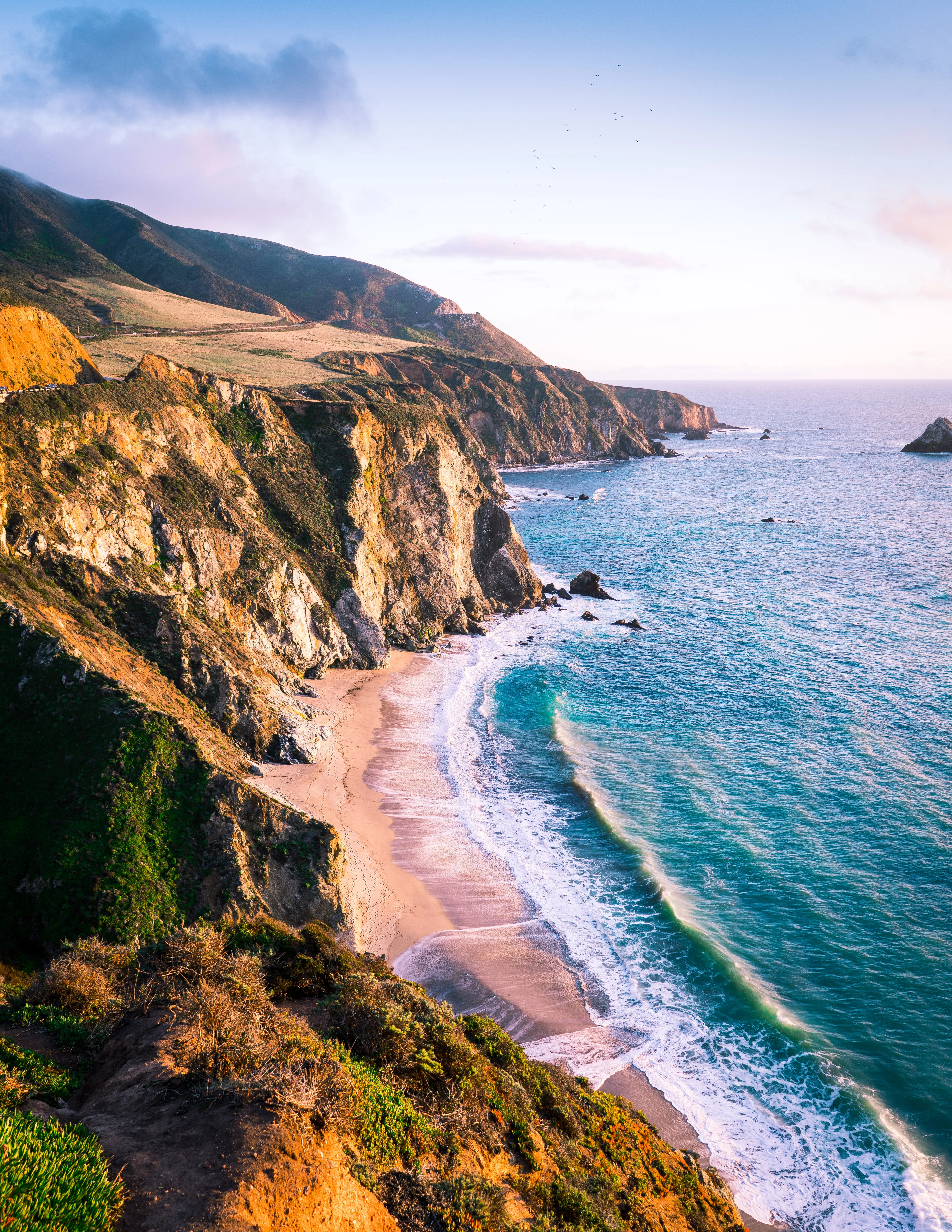 Scenic Coastal Road Along Ocean Cliff and Blue Sky Wallpaper