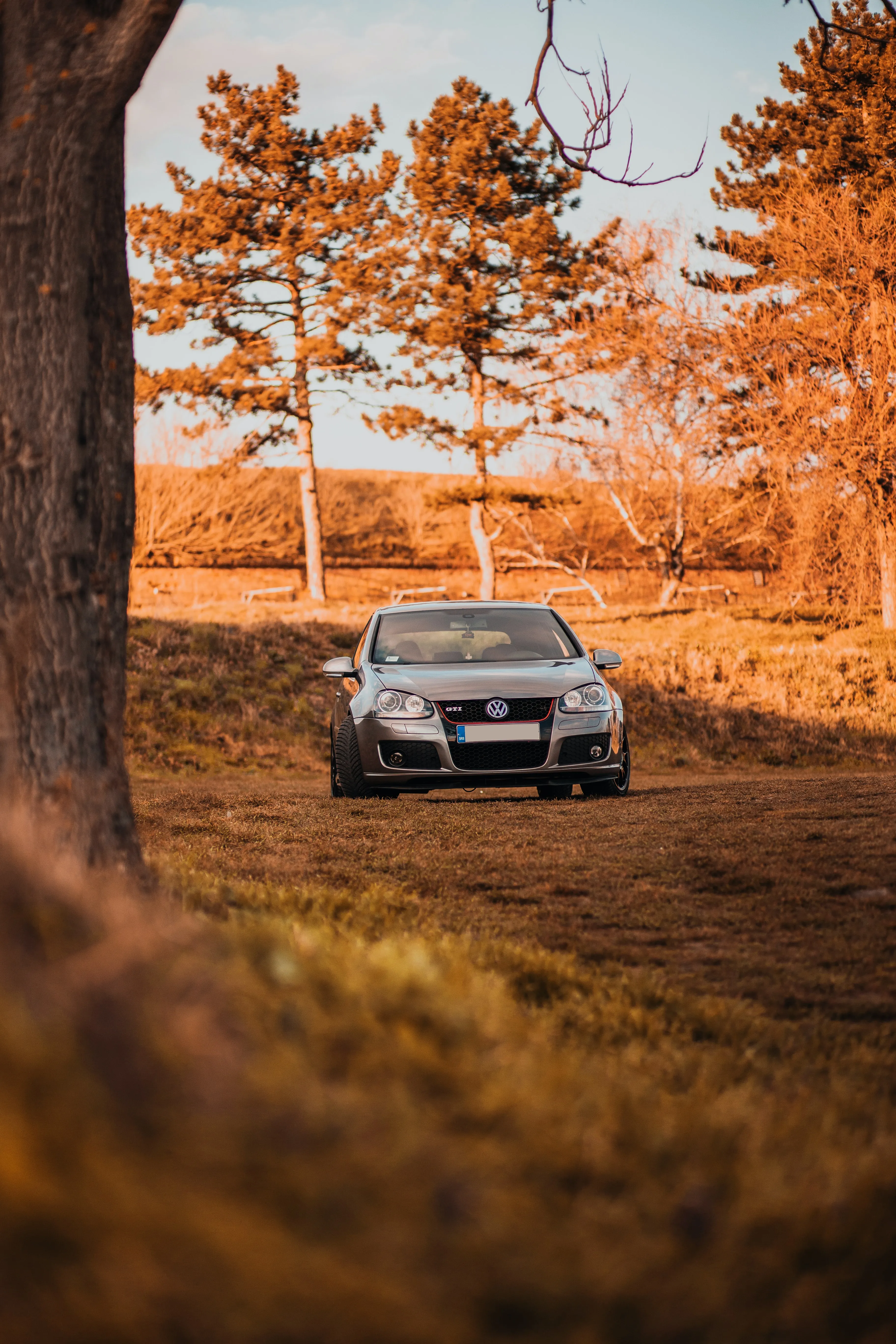 Scenic Countryside Car Wallpaper with Autumn Trees