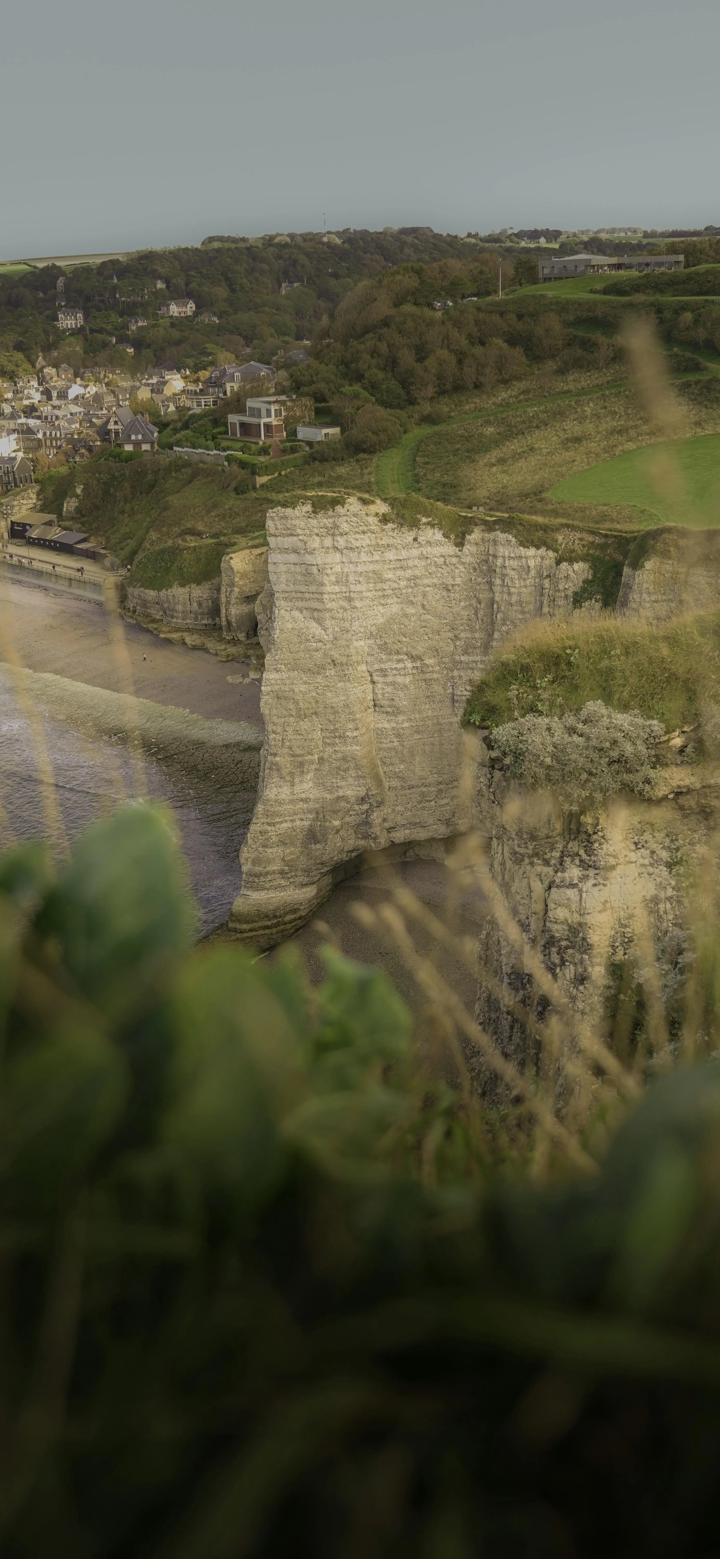 Scenic Hillside Ruins with Lush Greenery and Path Image