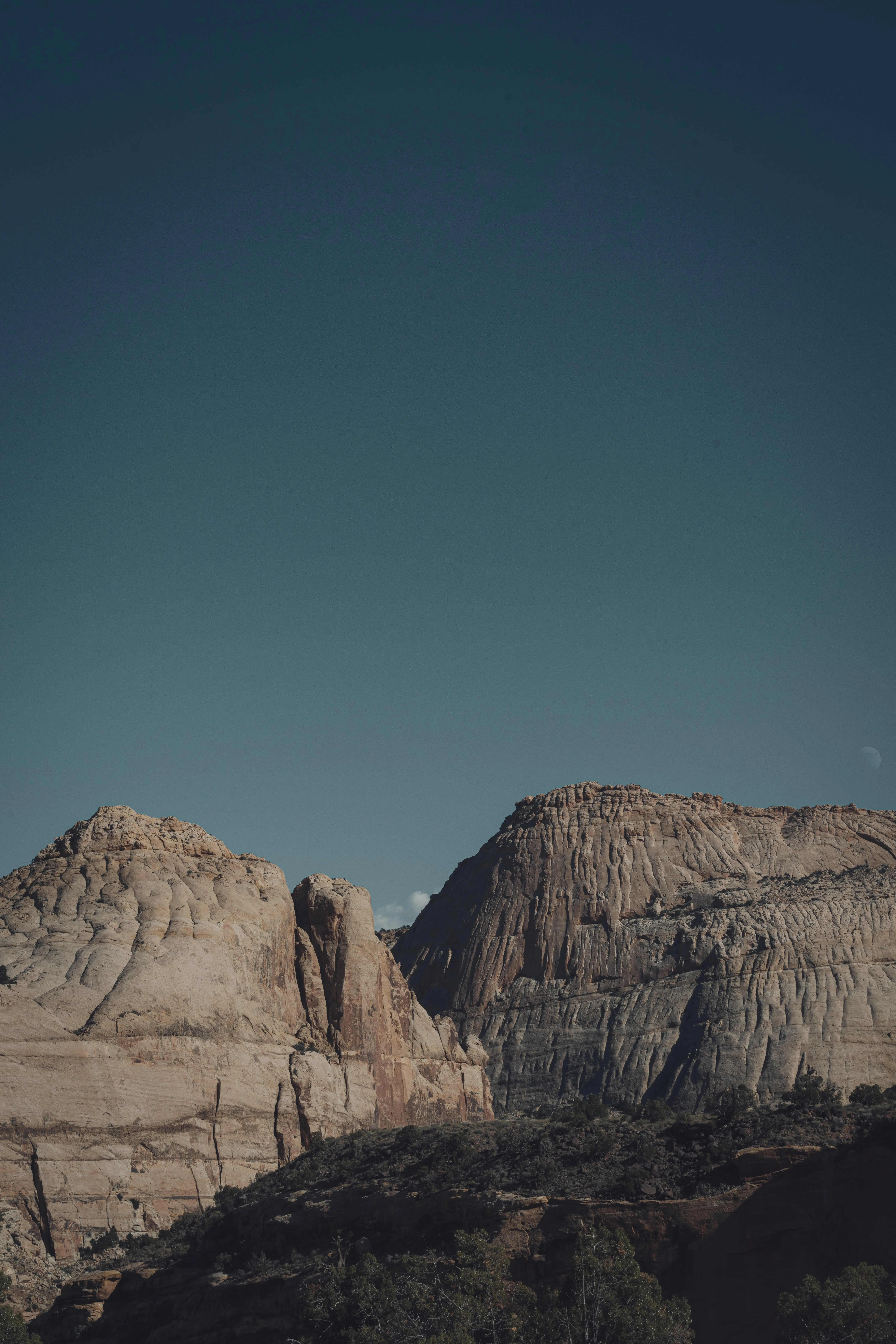 Scenic View of Mountain Cliffs Under Clear Sky Wallpaper