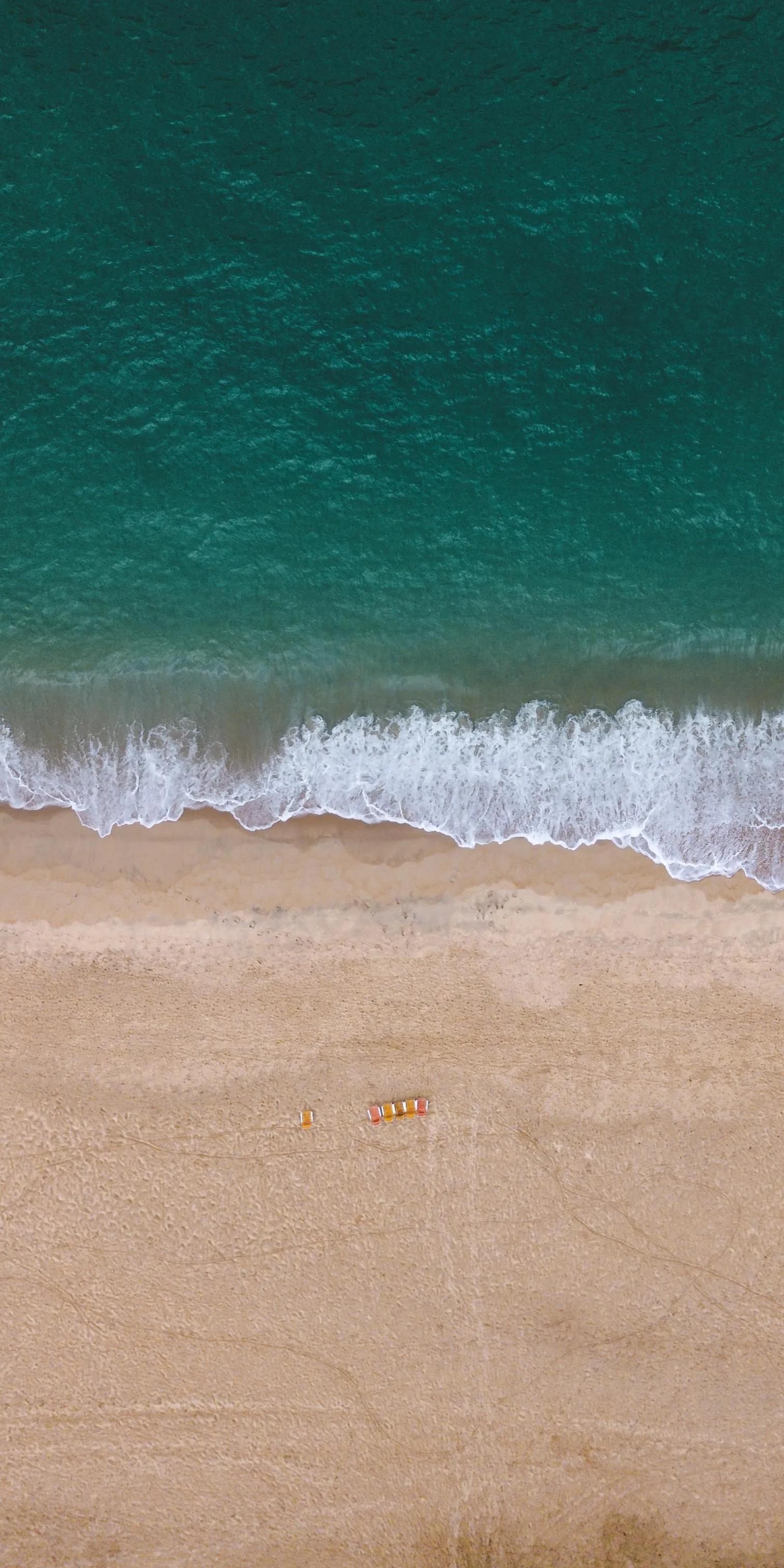 Serene Beach Scene with Clear Water and Gentle Waves