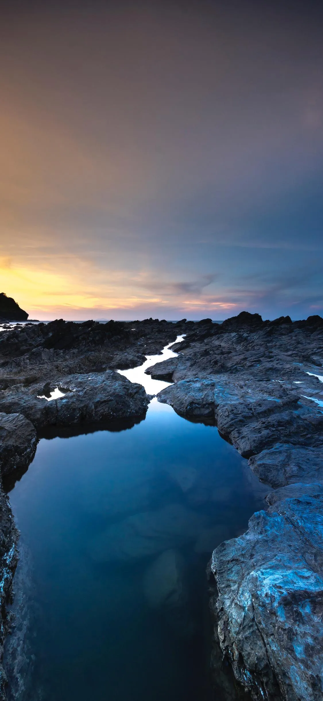Serene River Flowing Through Ice Mountains at Sunset