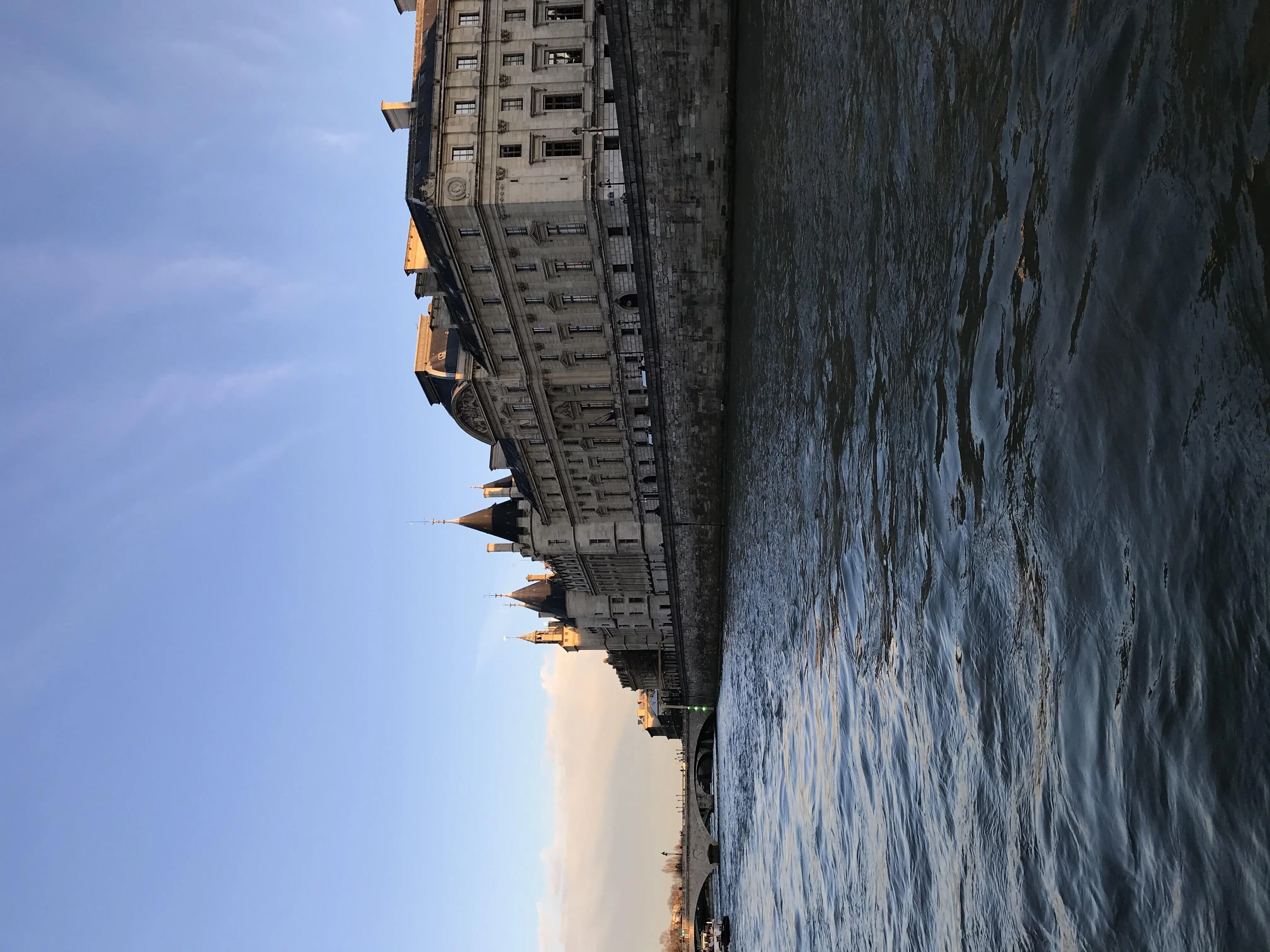 Serene Seaside View with Calm Waters and City Skyline