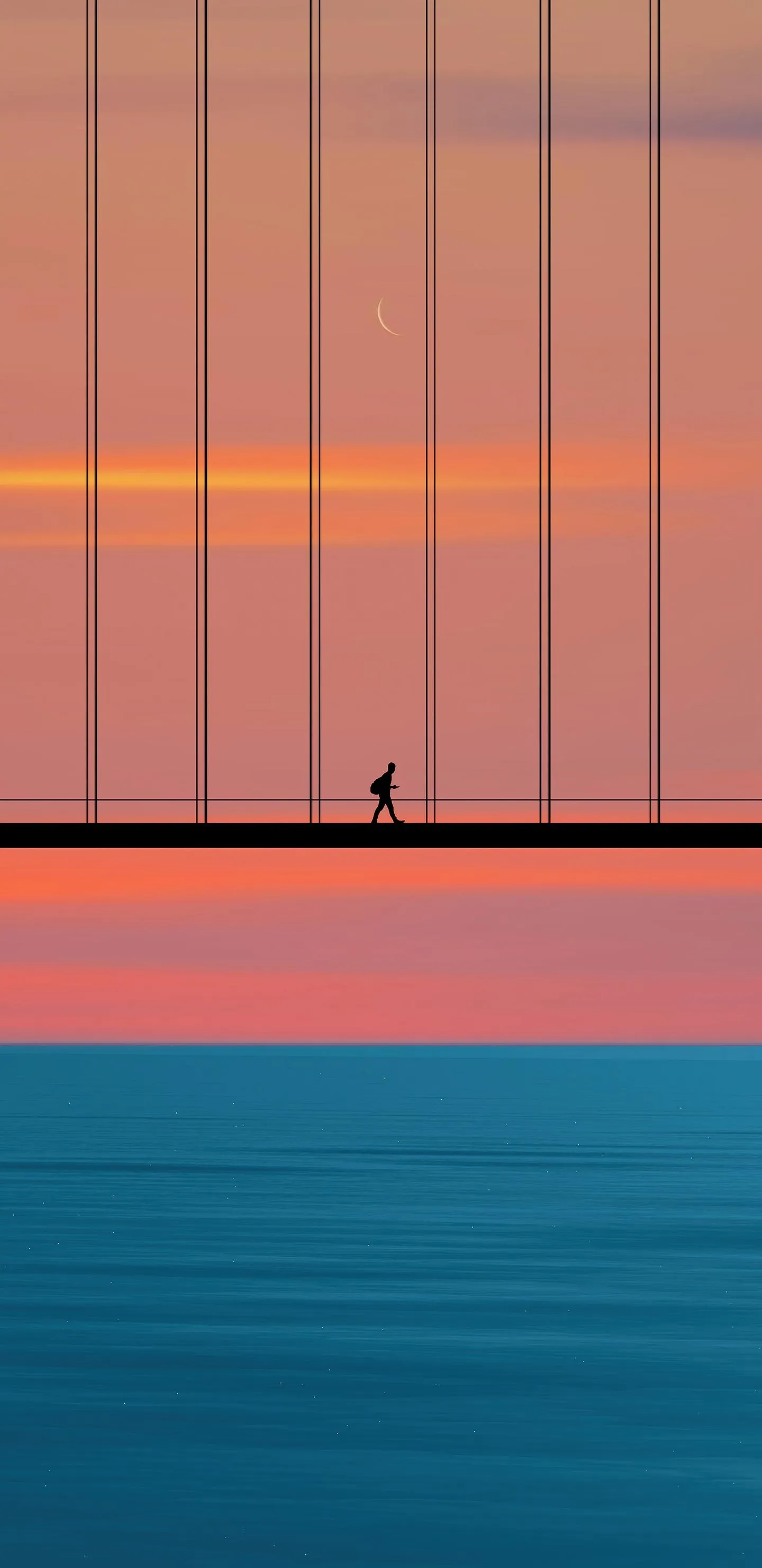 Serene Sunset Walk Across a Bridge Over Calm Waters