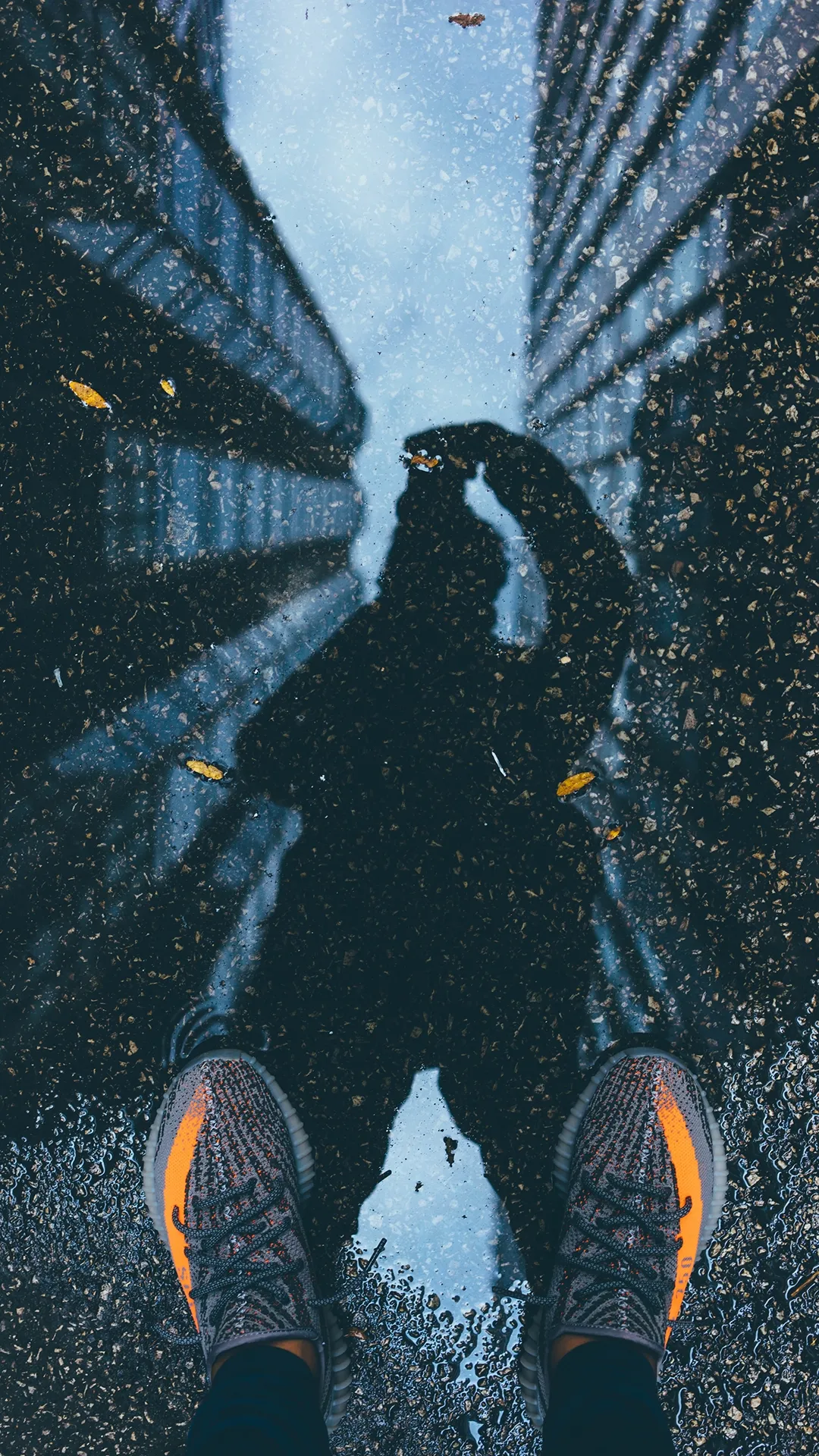 Shadowy Hero Standing Between Tall Buildings Wallpaper