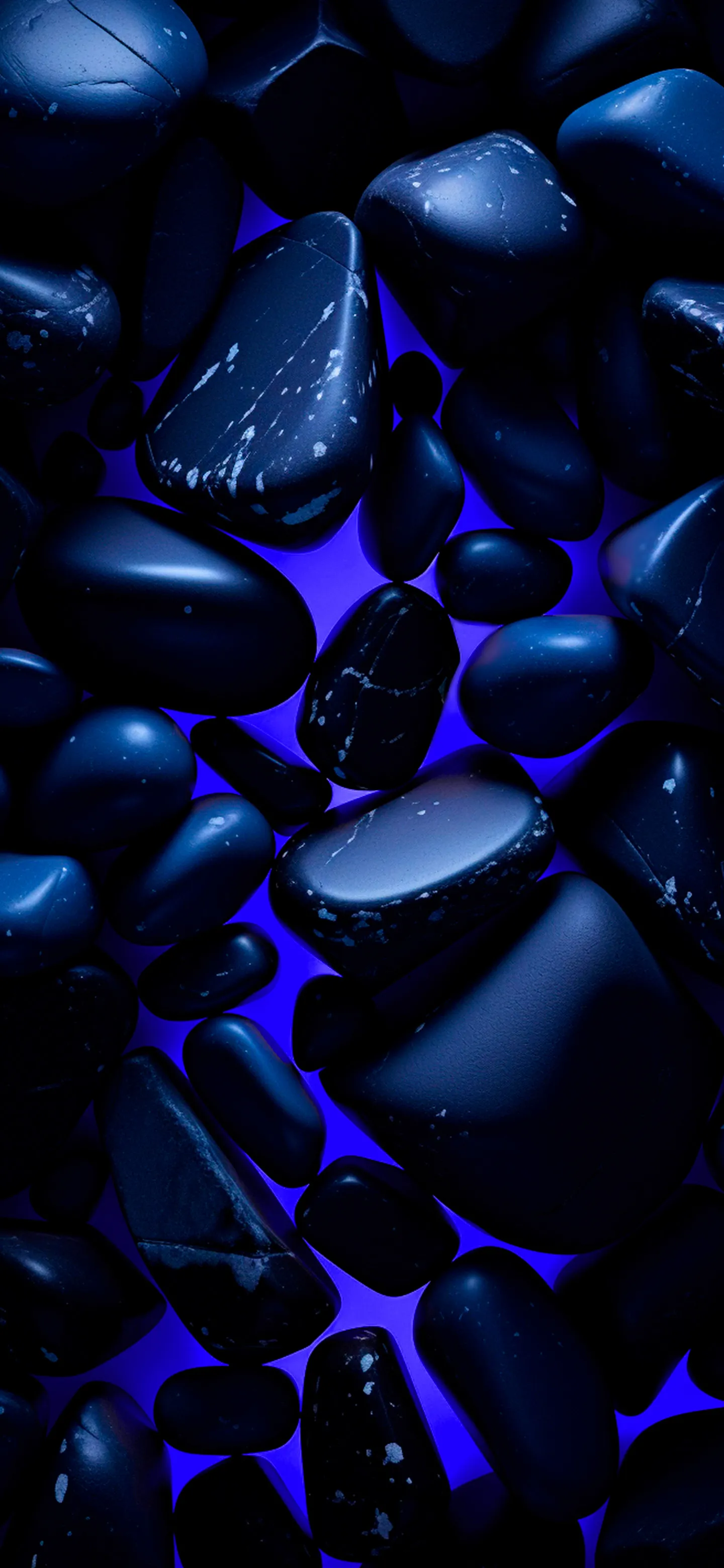 Shiny Blue Gemstones Scattered on Dark Background Image