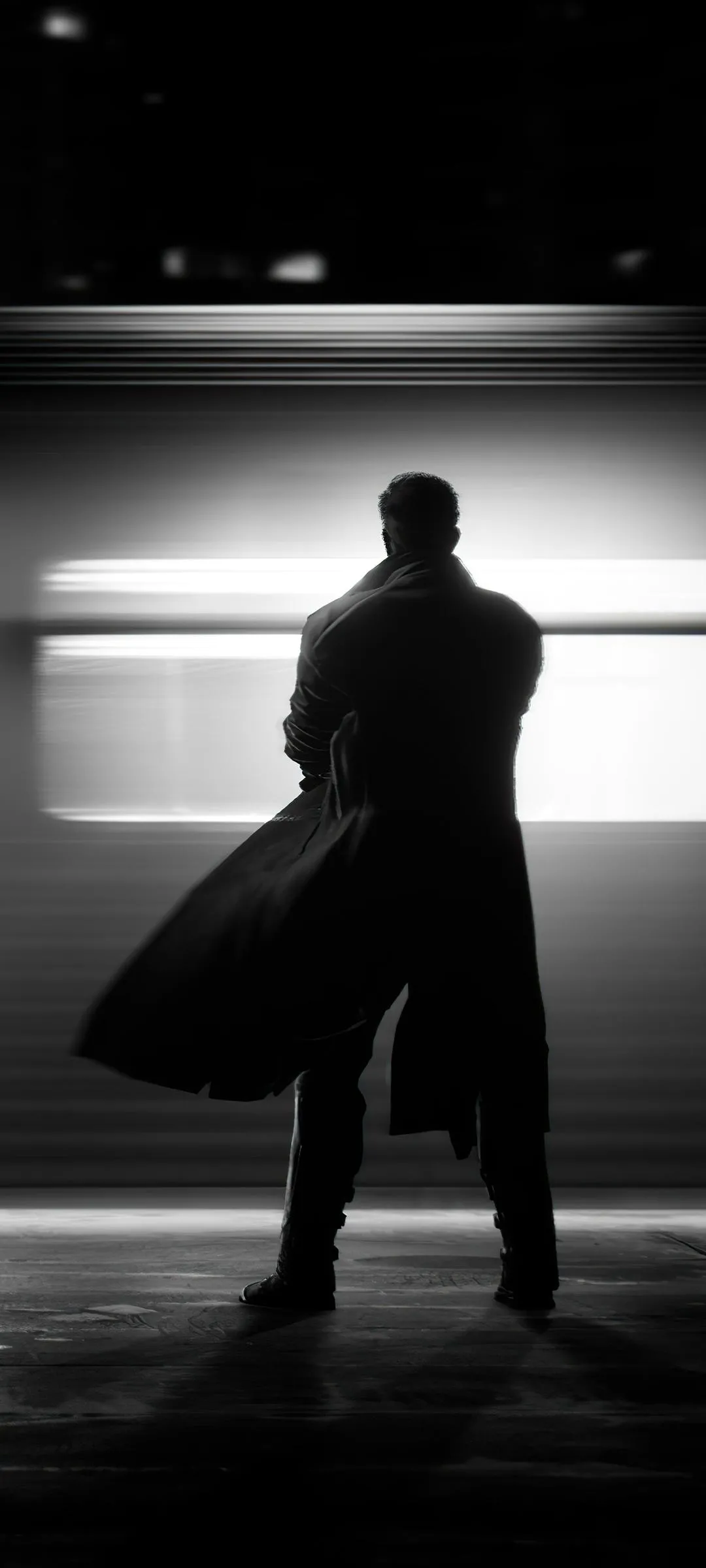 Silhouette Walking Alone Under City Streetlights Wallpaper