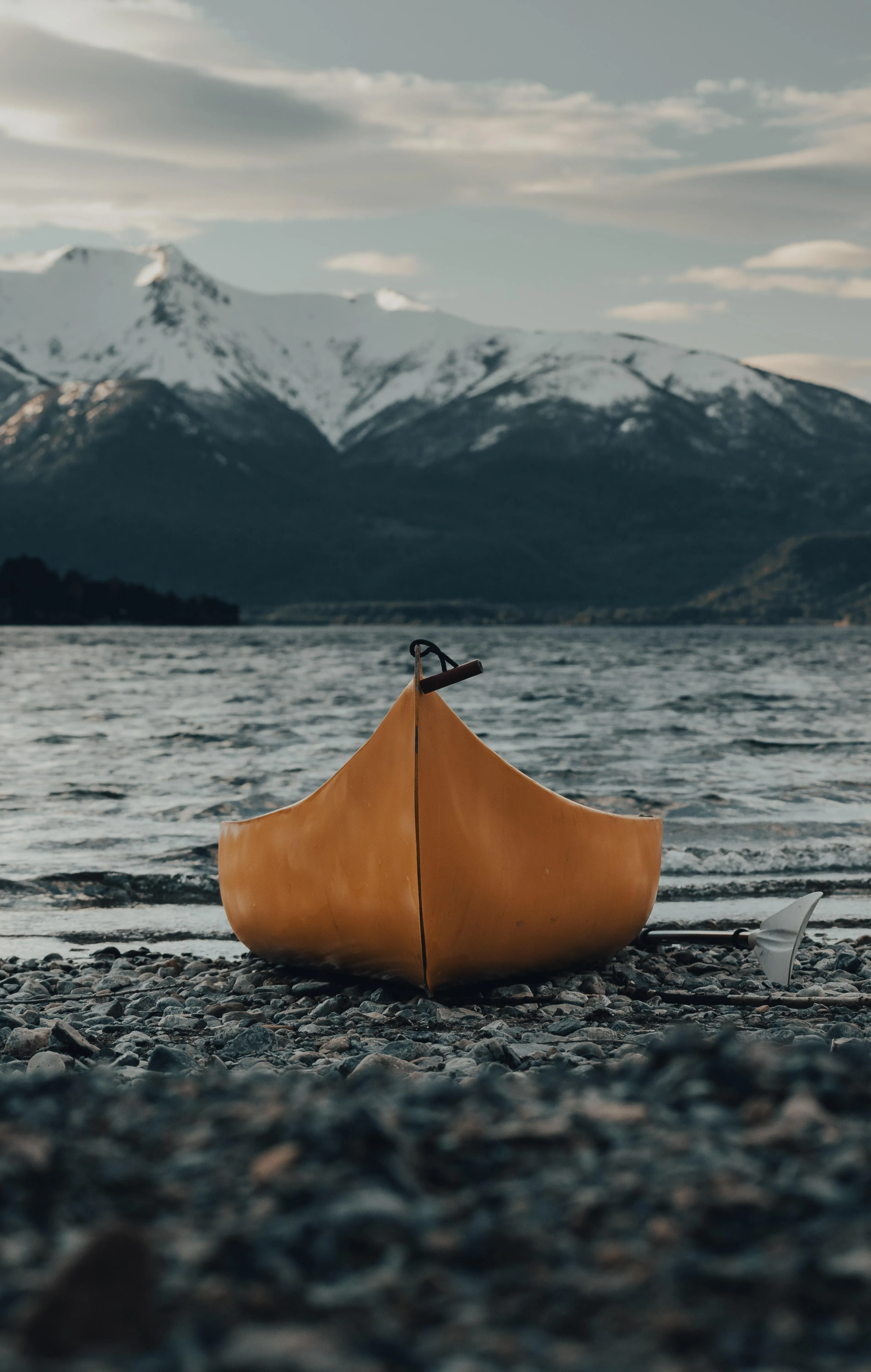 Small Wooden Boat Floating on a Quiet Mountain Lake