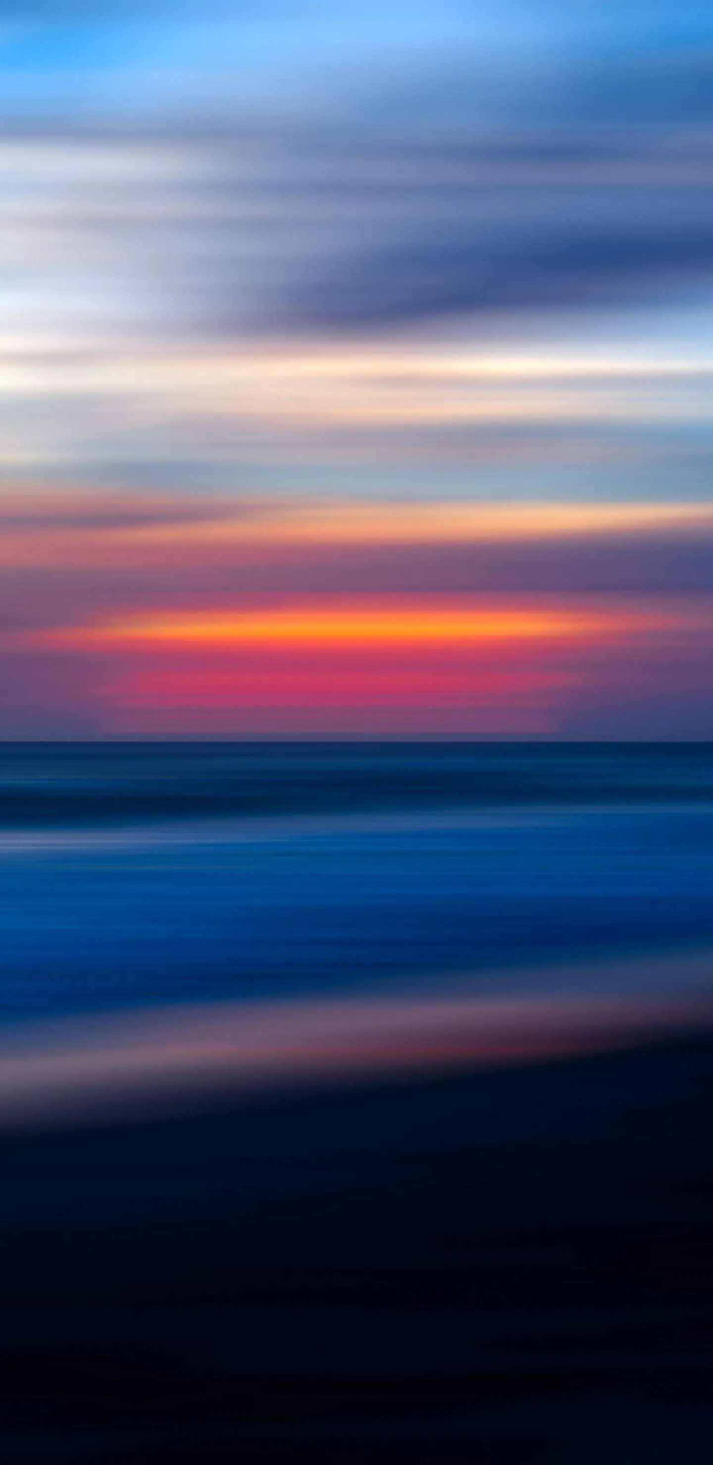 Smooth Blurred Gradient Lines Moving across a Sunset Sky