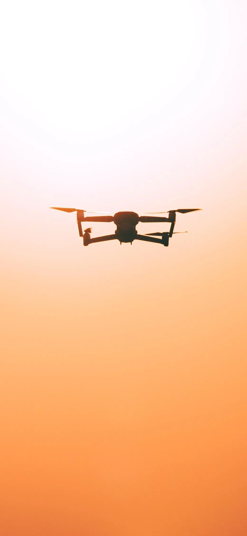 Smooth Drone in the Sky Over Cityscape Mobile Wallpaper