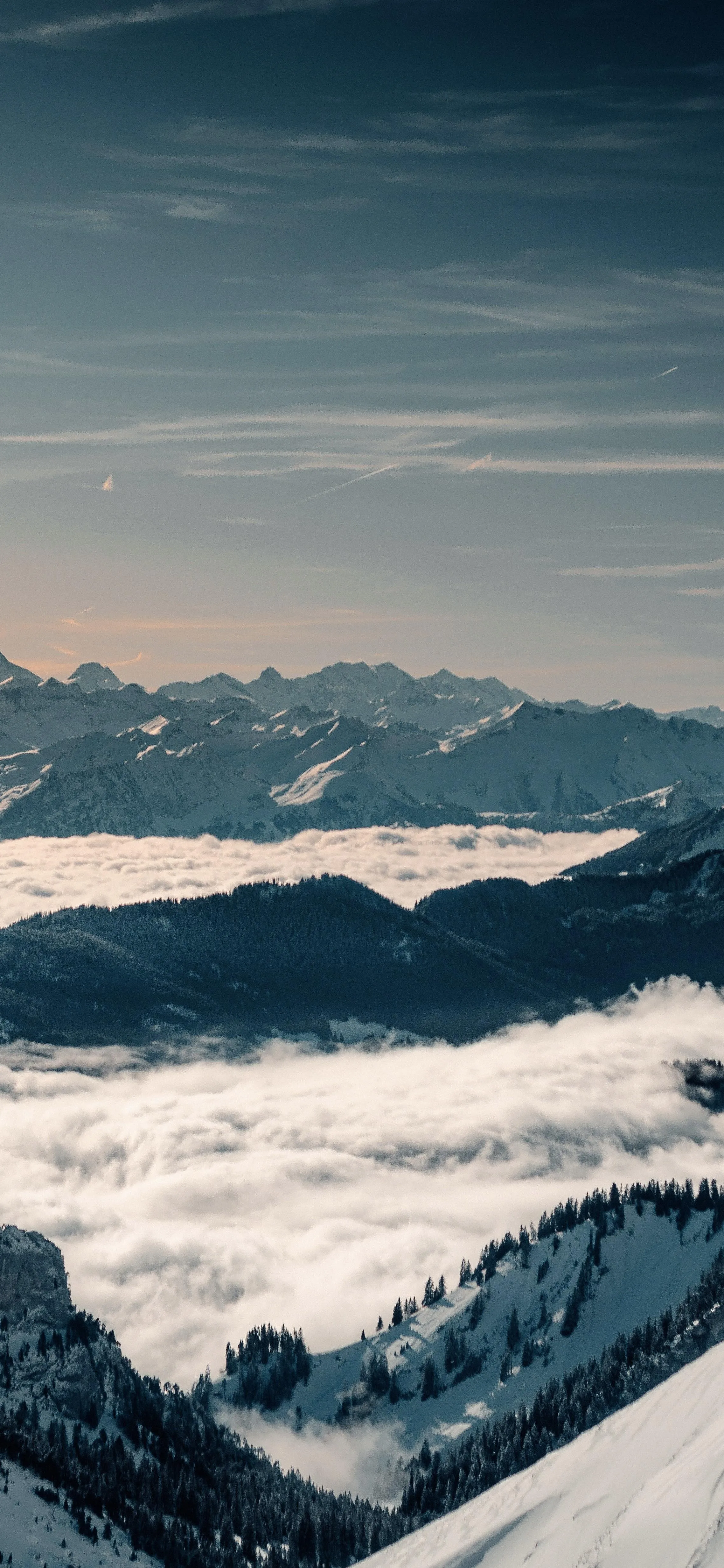 Snow Covered Mountains and Forest Under Blue Cloudy Sky
