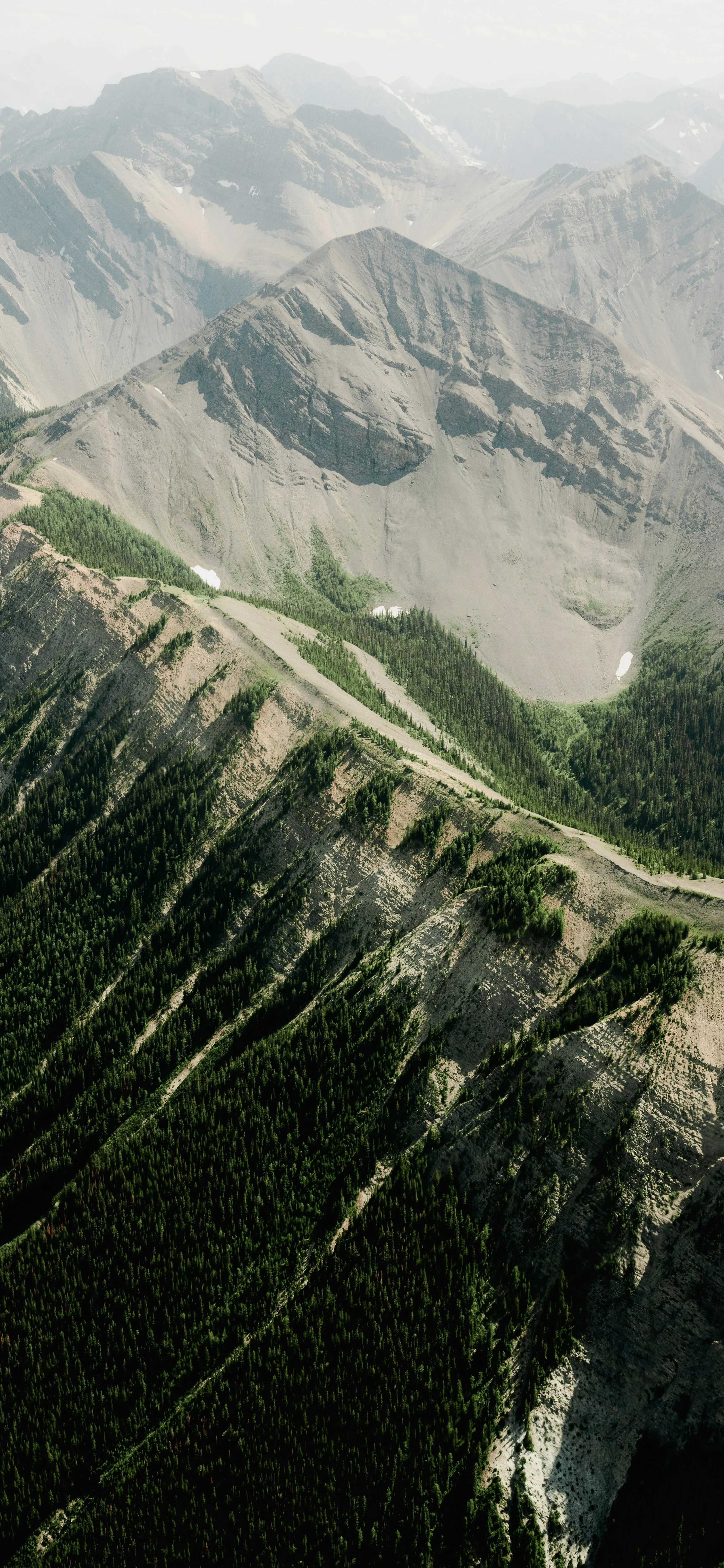 Snowy Mountain Landscape with Aerial Forest View Wallpaper