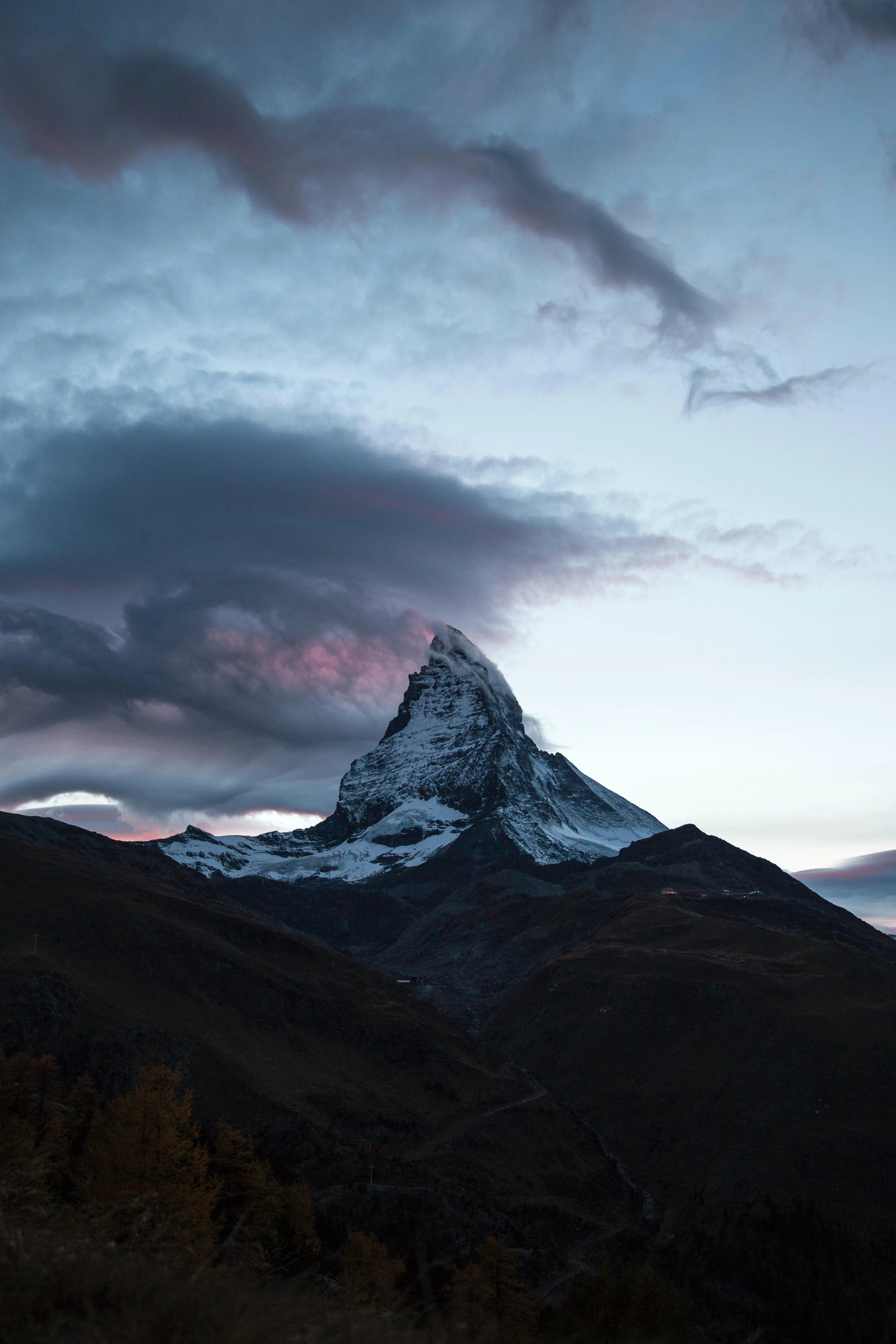 Snowy Mountain Peak Under Cloudy Sky in Evening Wallpaper