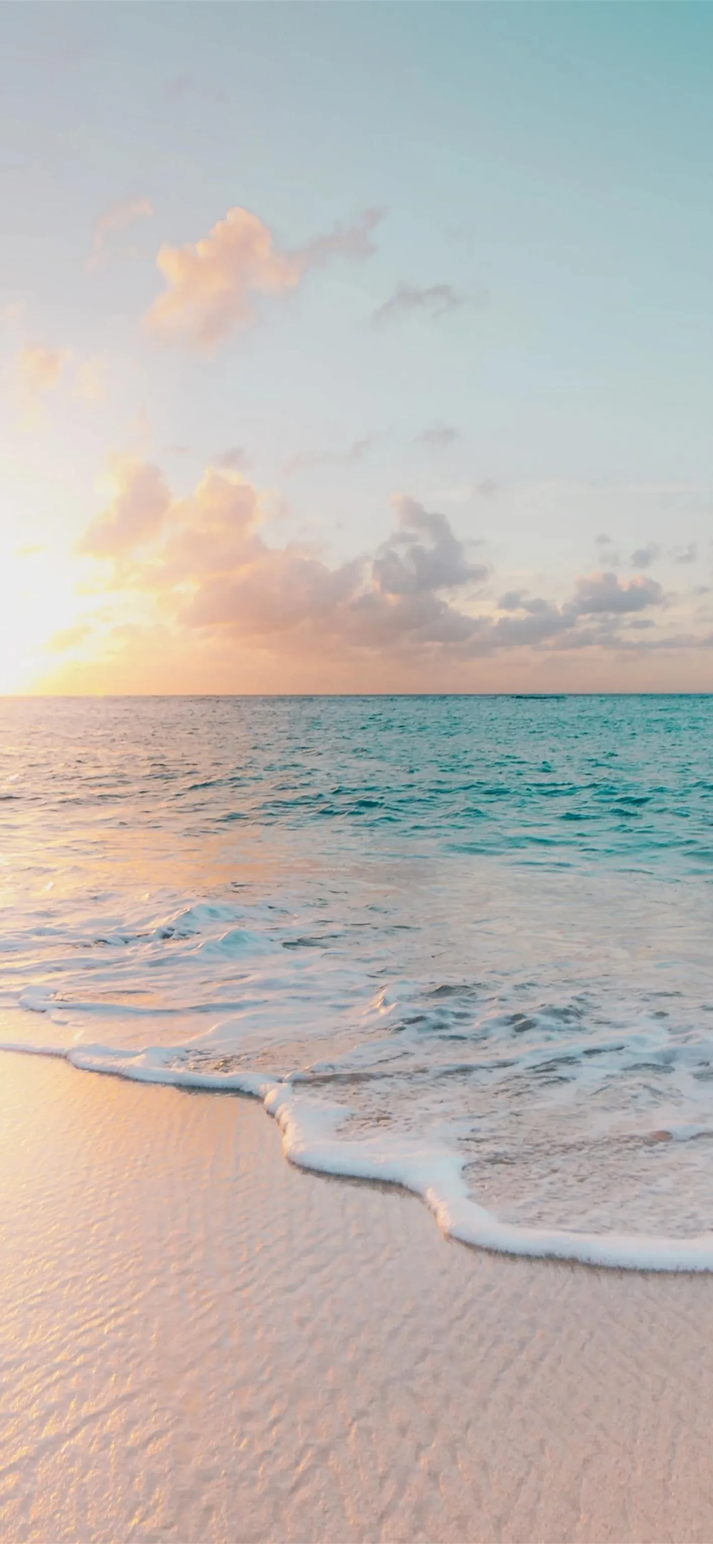 Soft Beach Sunrise with Calm Ocean Waves Wallpaper HD