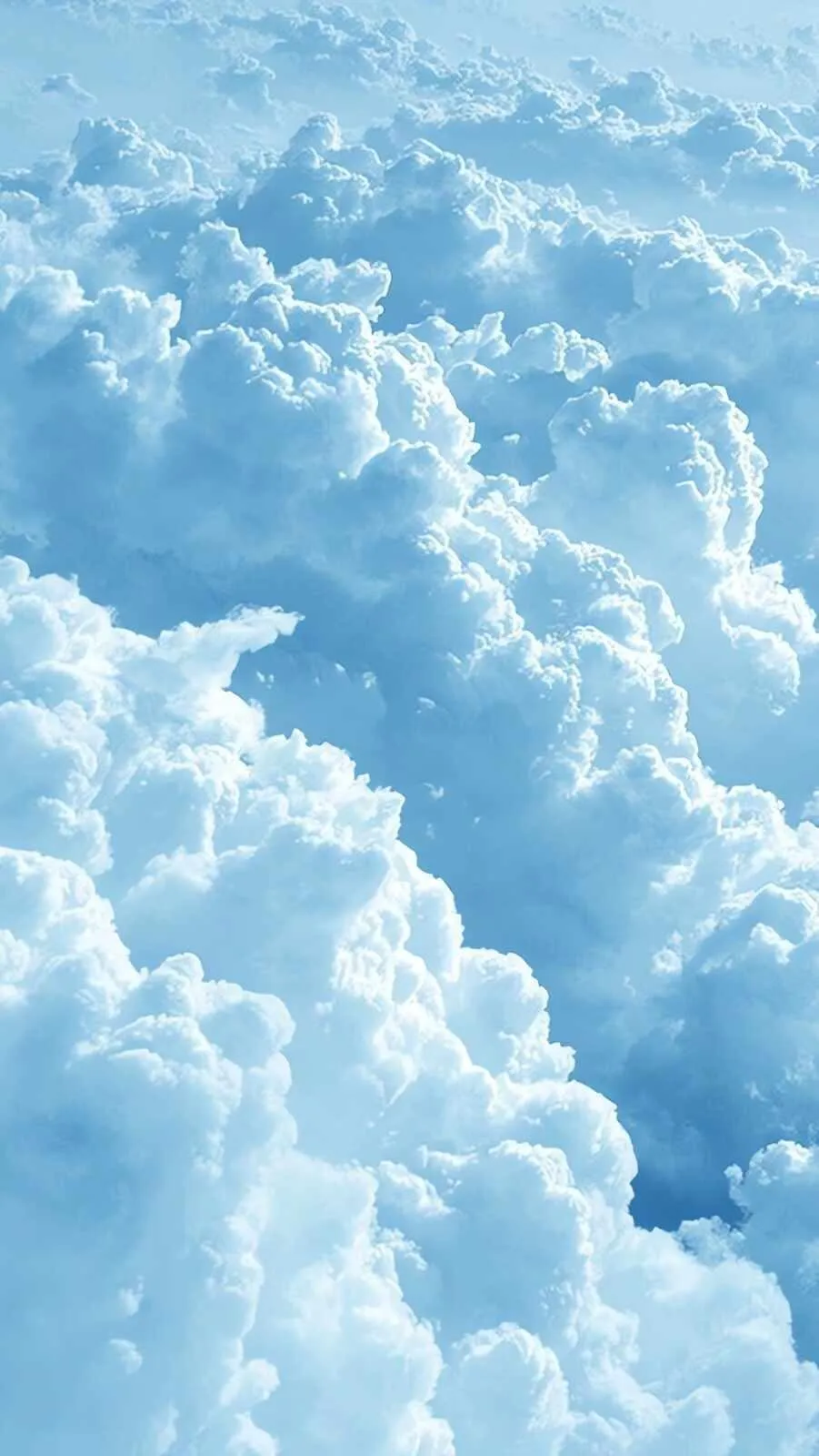 Soft White Clouds Drifting Across Bright Blue Sky Image