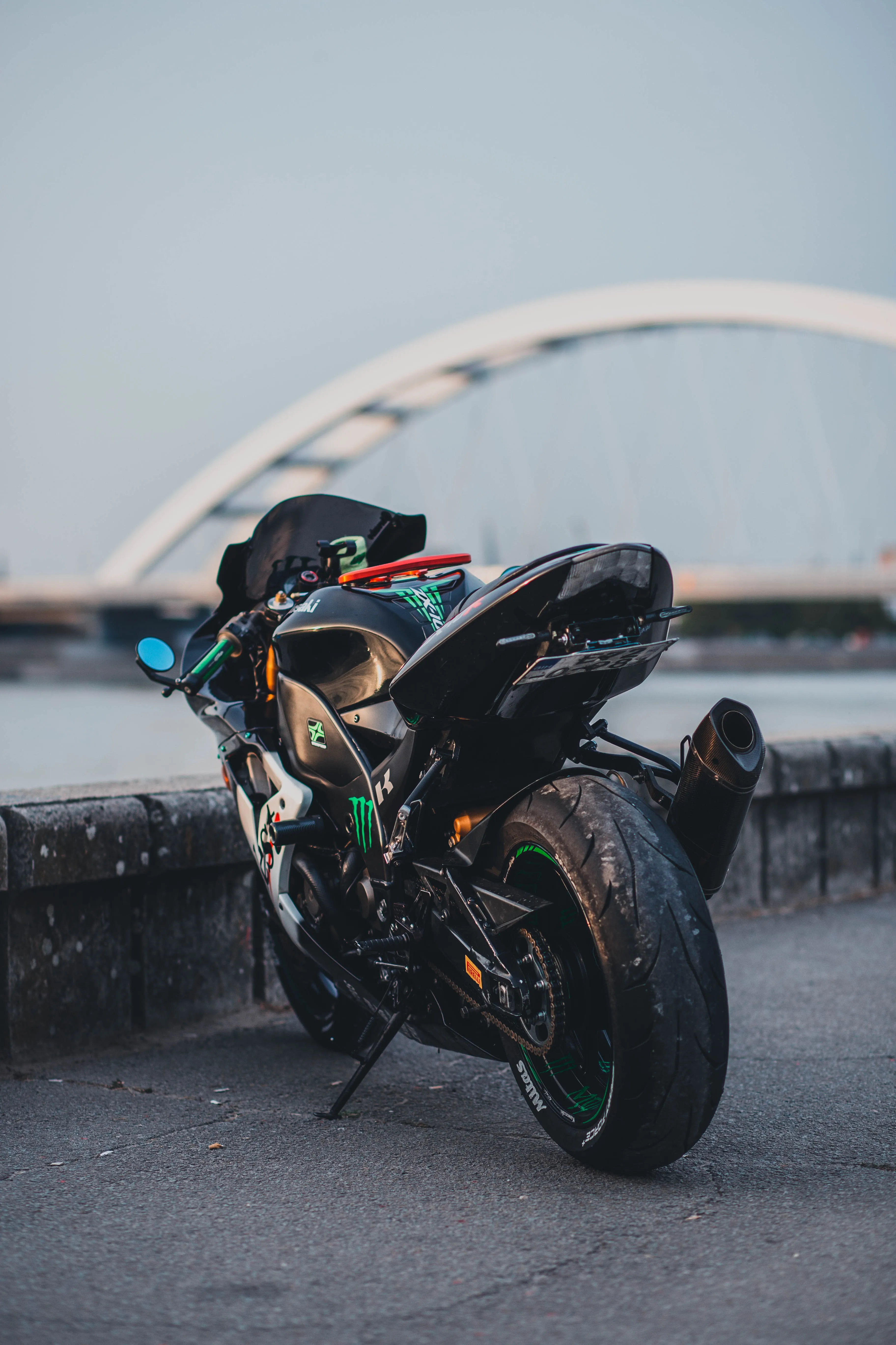 Sports Bike Leaning on Curve Under Bridge Light Wallpaper