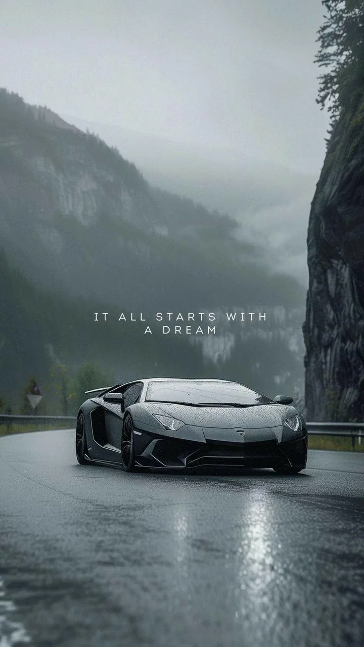 Sports Car Driving Through Misty Mountains with Quotes Image