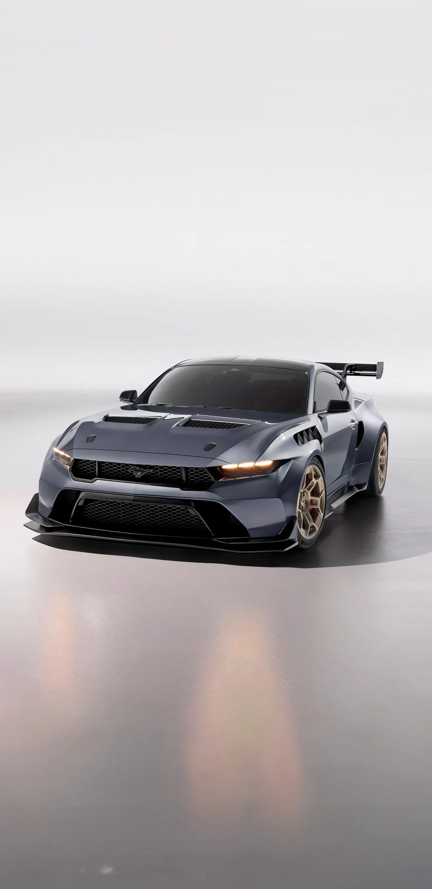 Sports Car on Misty Road with Warm Light Glow Wallpaper