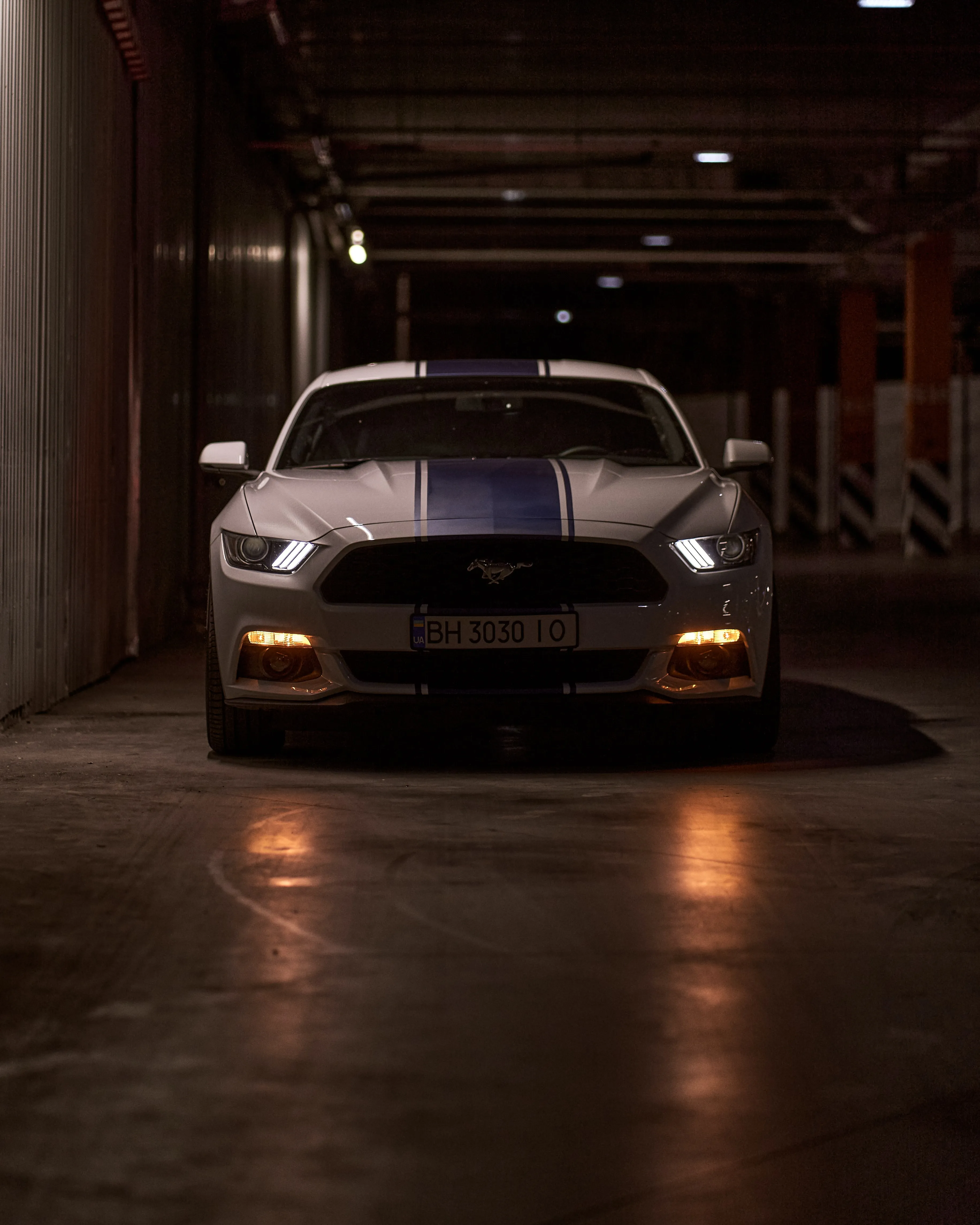 Sports Car Parked Inside Dark Urban Garage Wallpaper