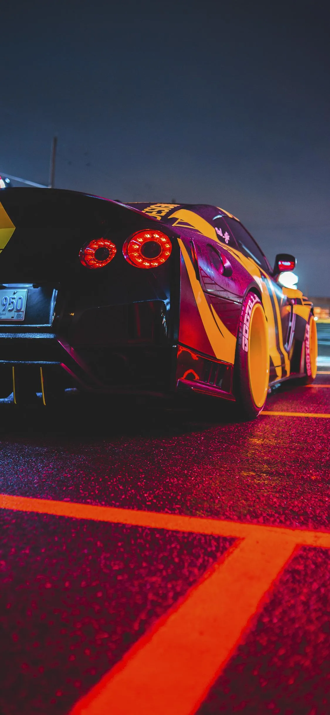 Sports Car Racing on Road Under Neon Street Lights